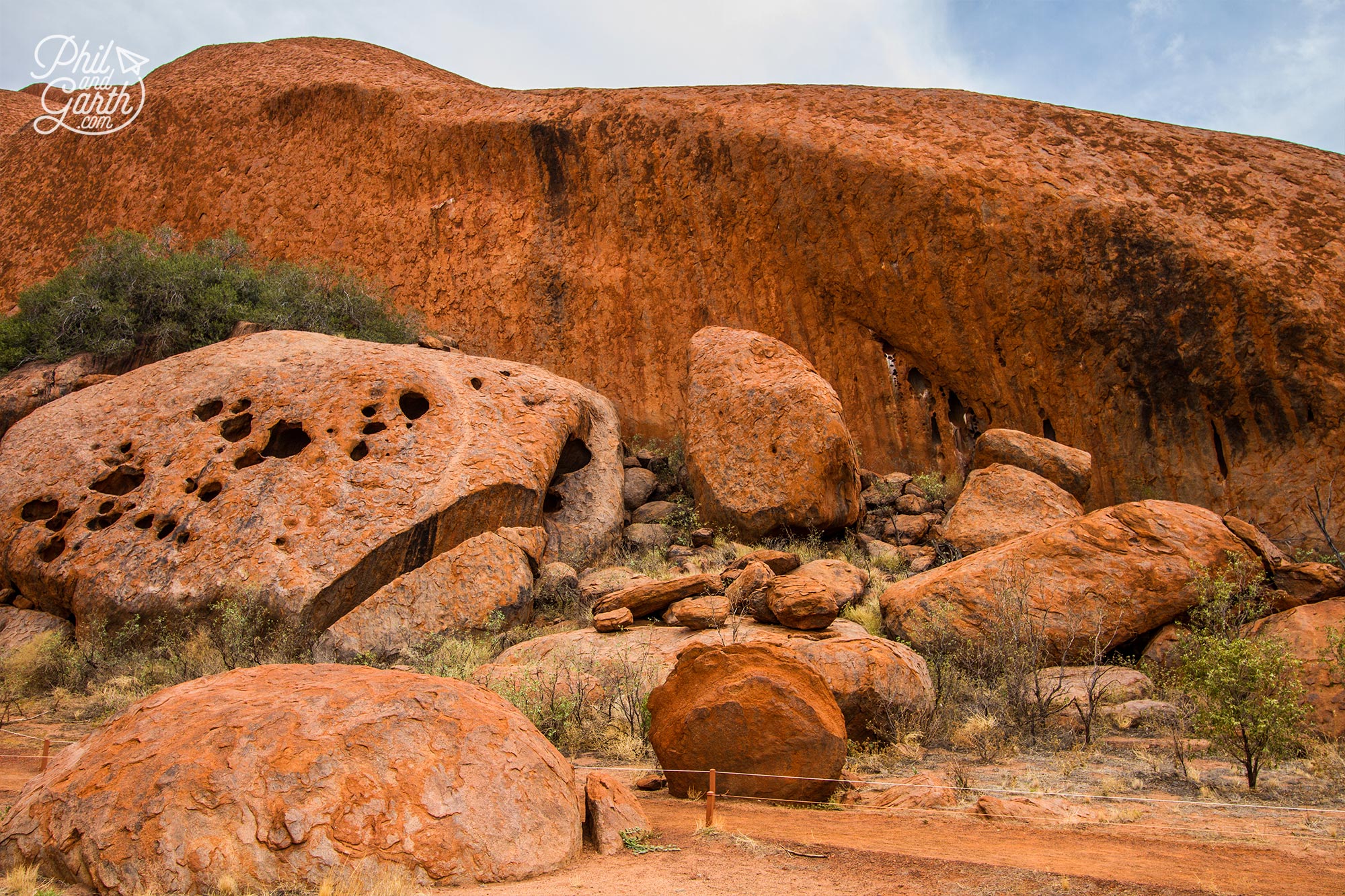 2 day uluru itinerary - Rusty orange views of Uluru close up on the walk