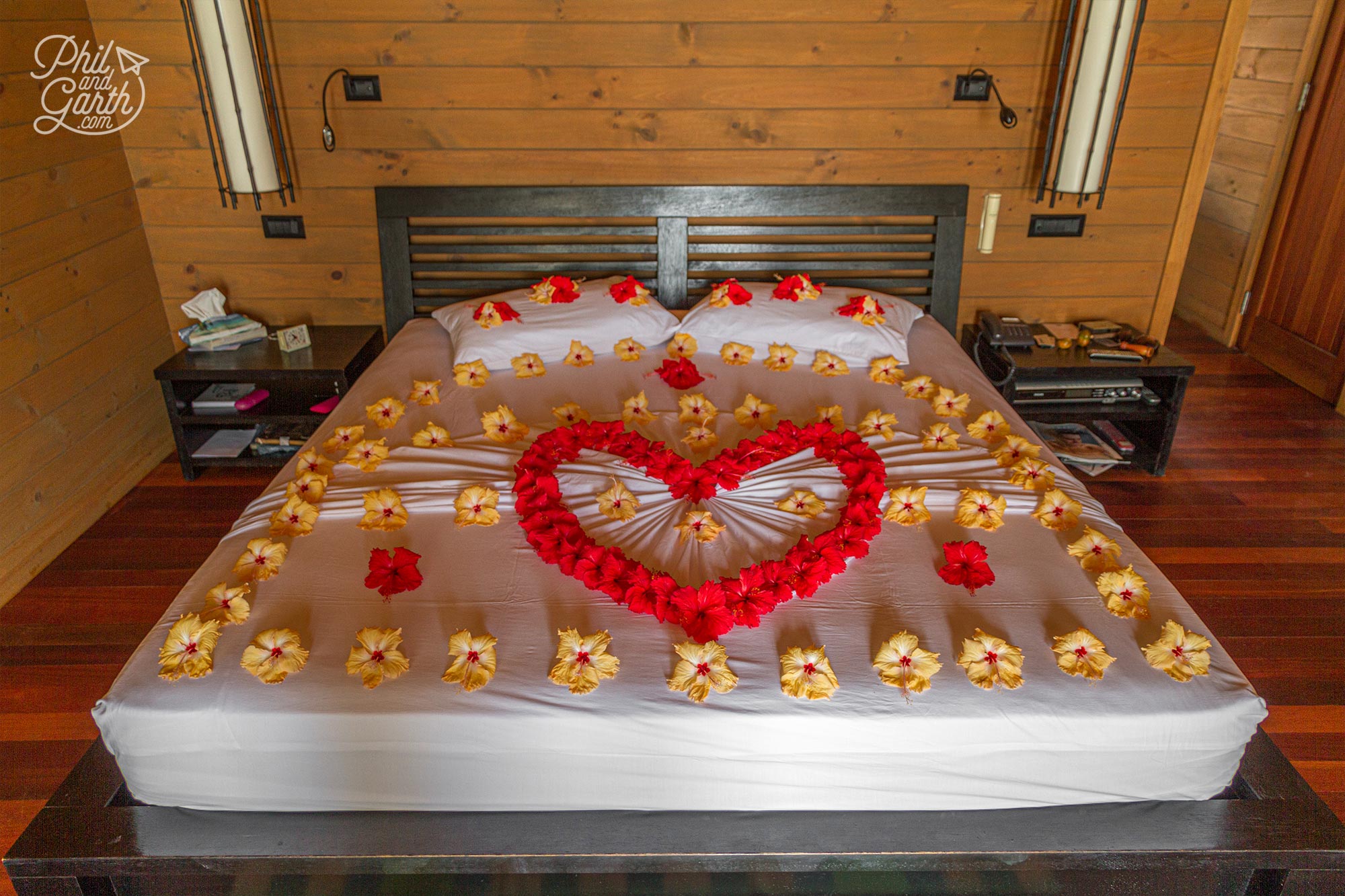 Beautifully decorated bed in our Jacuzzi Water Villa