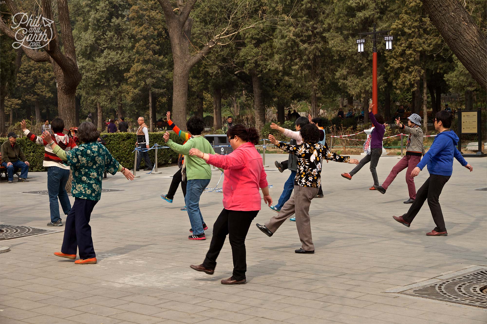 People exercise in the tranquil Jingshan Park