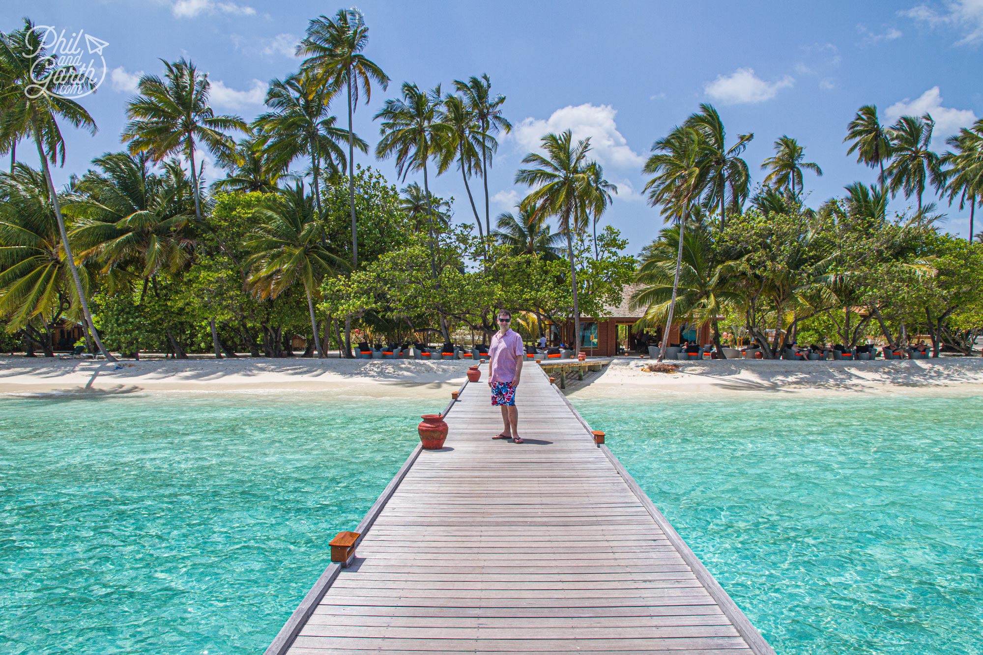 Phil on the jetty from our villa leading to the Pavilion Bar