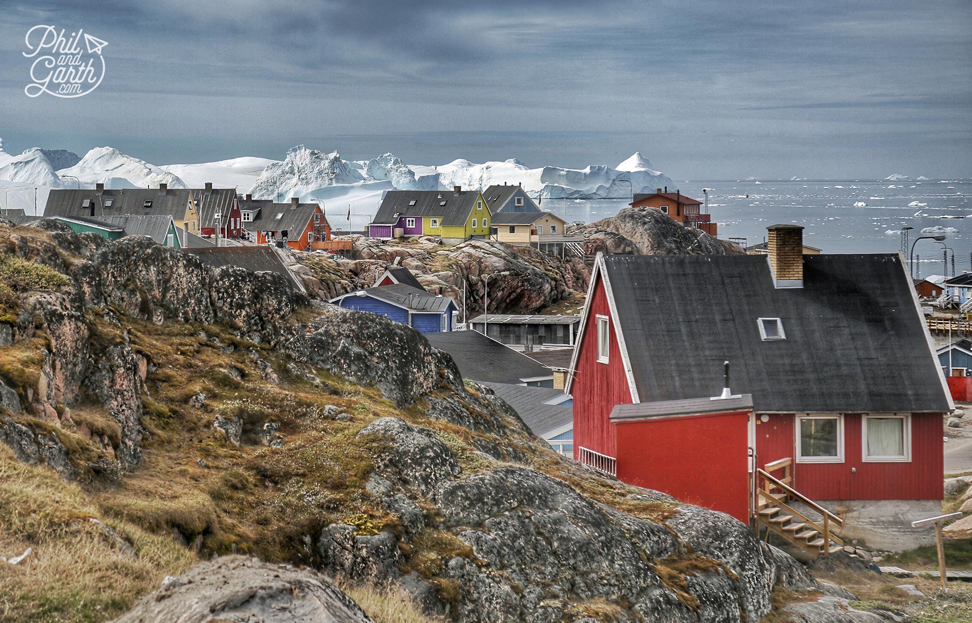 Ilulissat homes and stormy clouds over disko bay