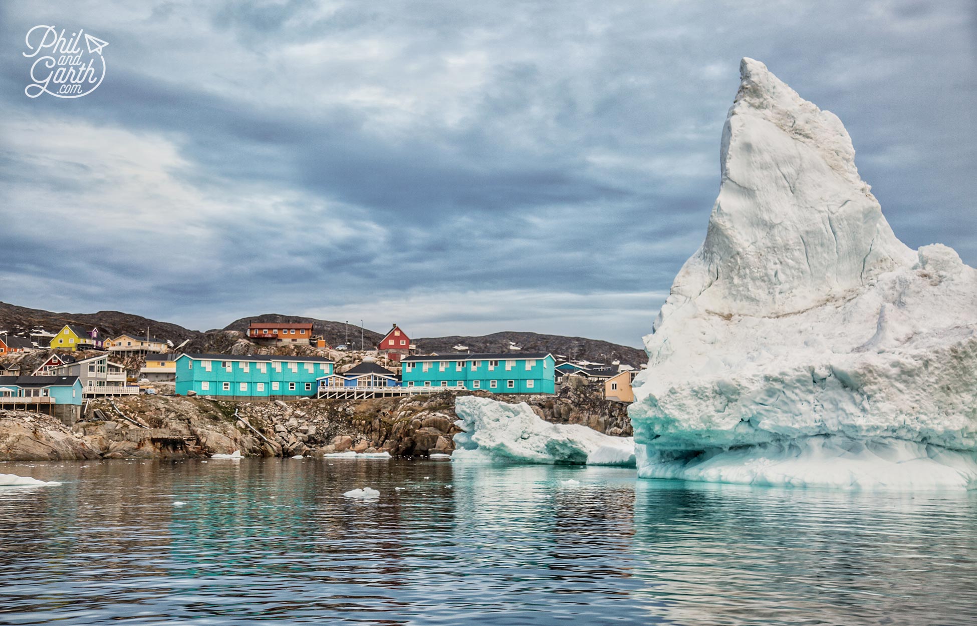 Passing Ilulissat homes and icebergs in Disko Bay