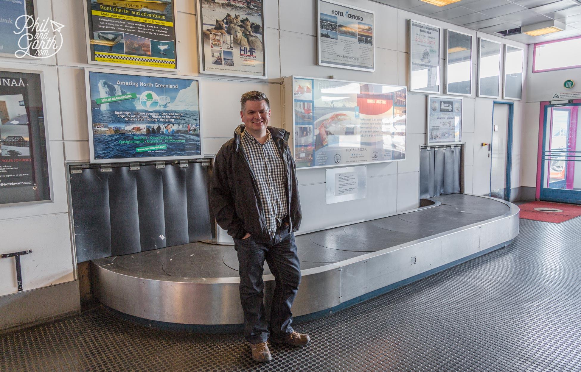 Phil at Ilulissat Airport with what must be the world's smallest baggage carousel