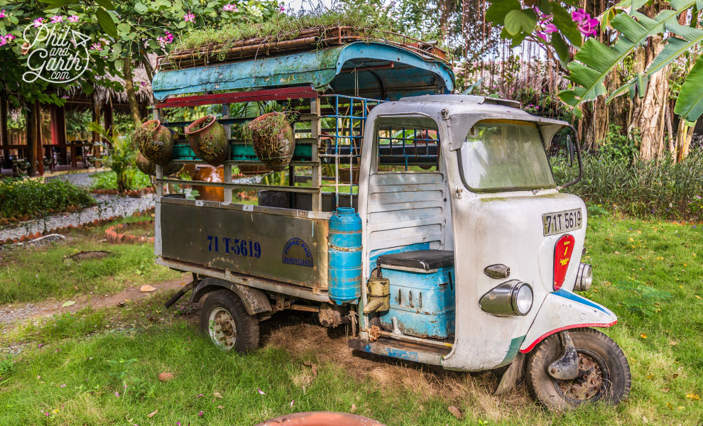 An old tuk tuk for displaying flowers