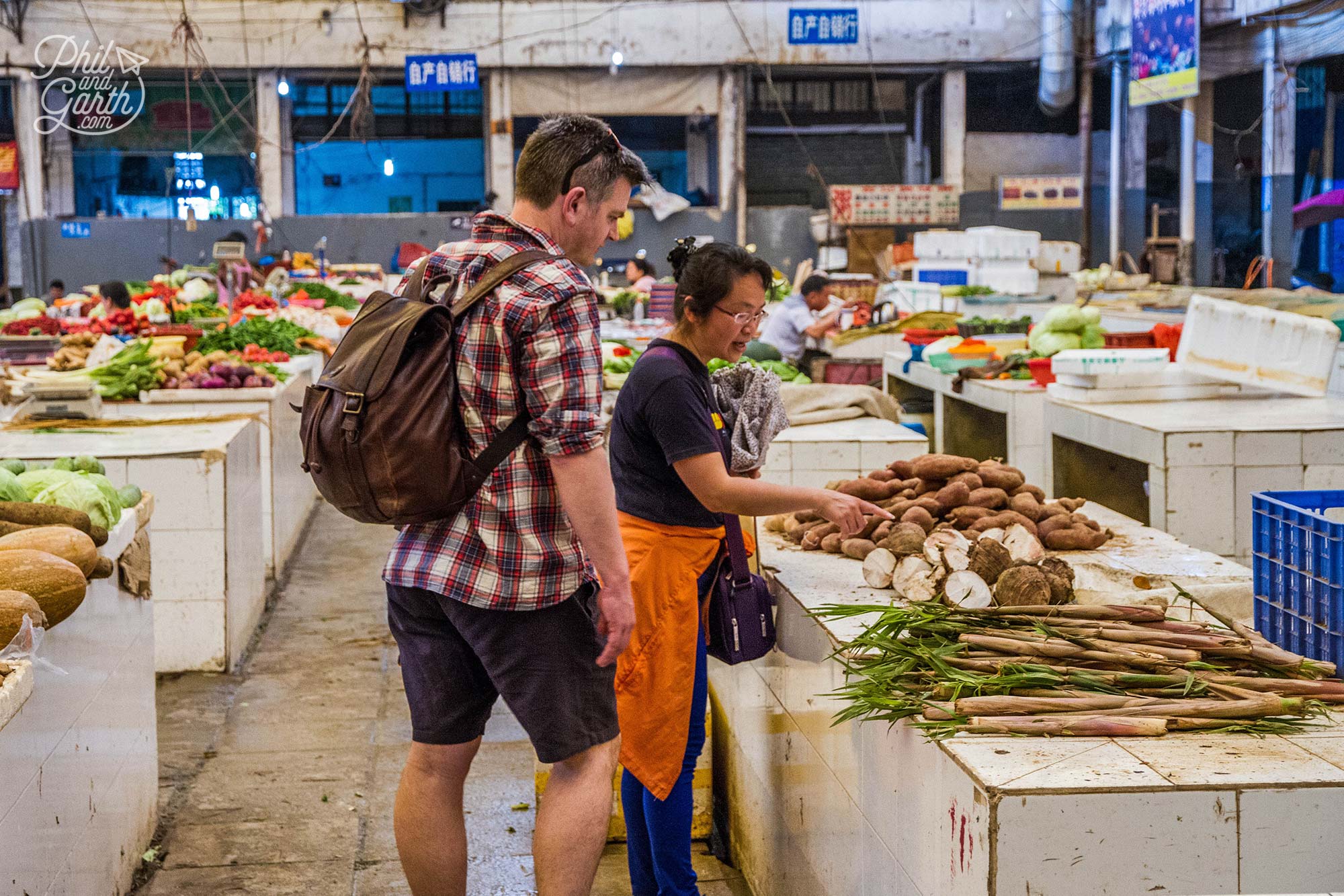 Inside the food market, our guide showing Phil bamboo shoots for sale