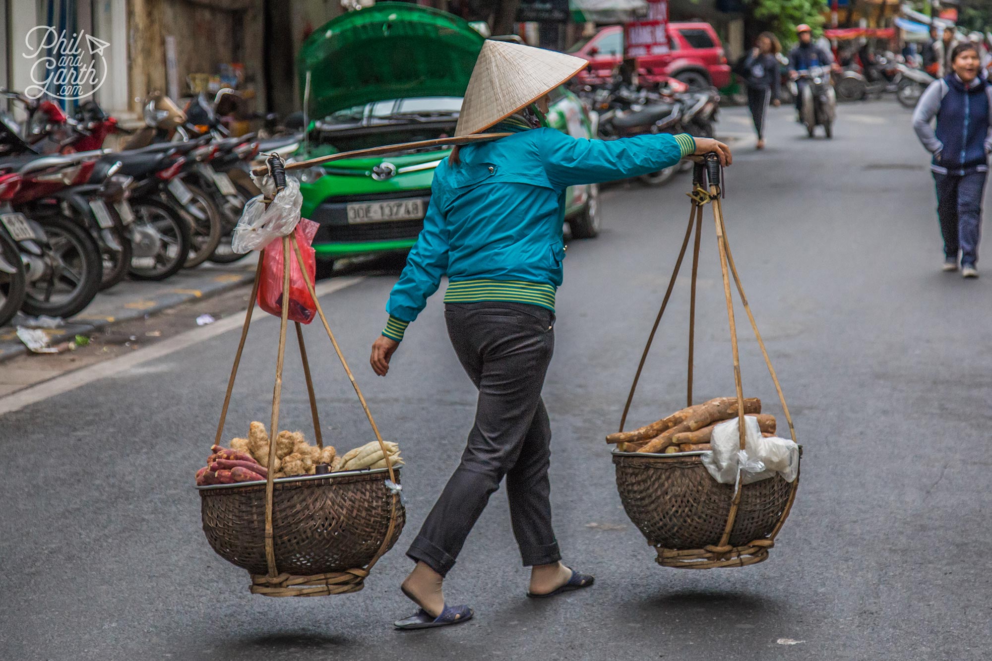 Lady and her yoke selling sweet potato