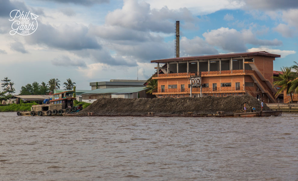 A barge with massive pile of soil