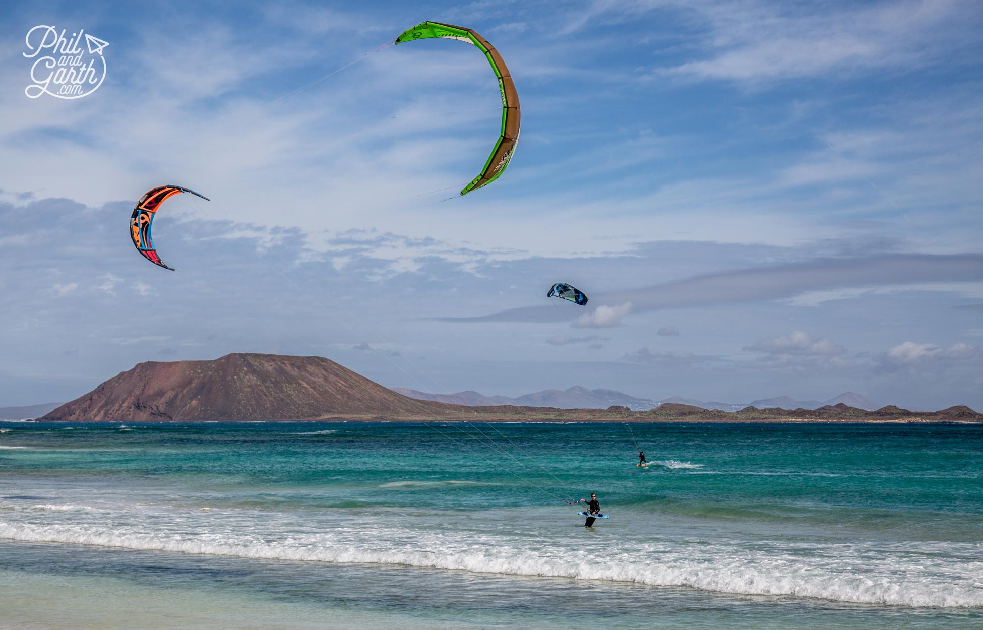 Kite surfers on Grandes Playas with the uninhabited island of Los Lobos in the background