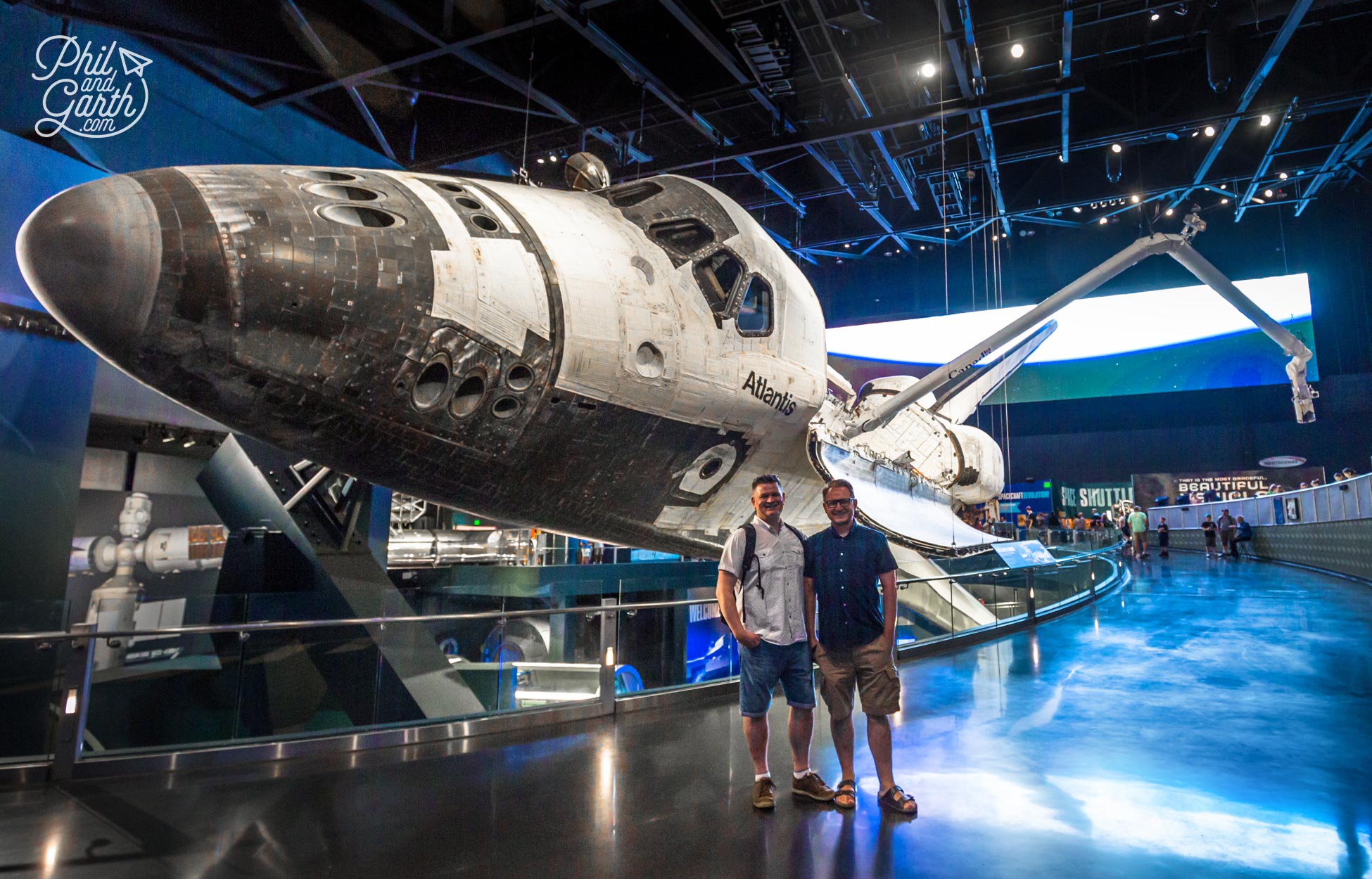 Phil and Garth stood next to Space Shuttle Atlantis