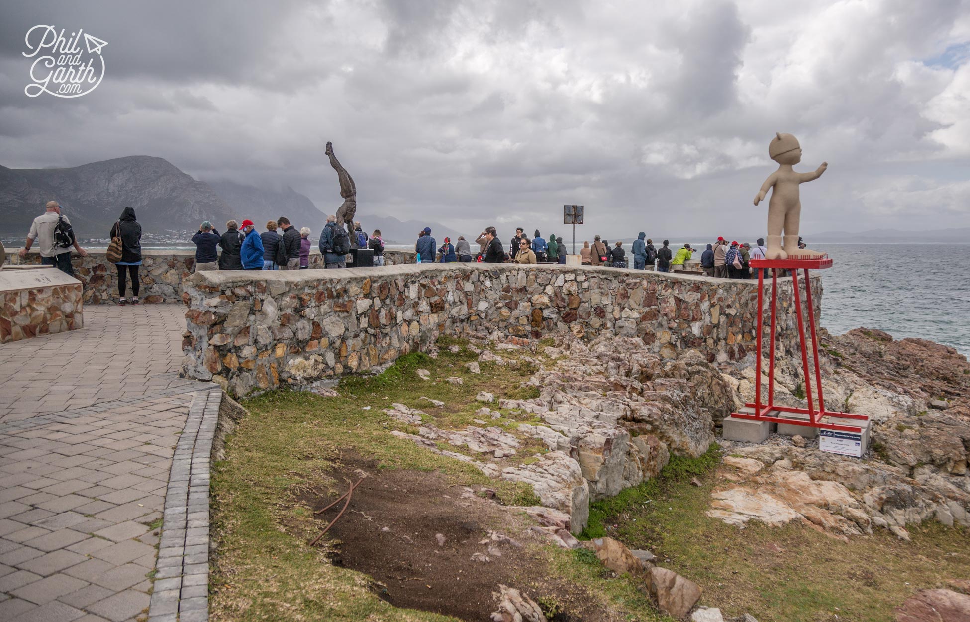 People gather at one of the cliff edge viewing platforms