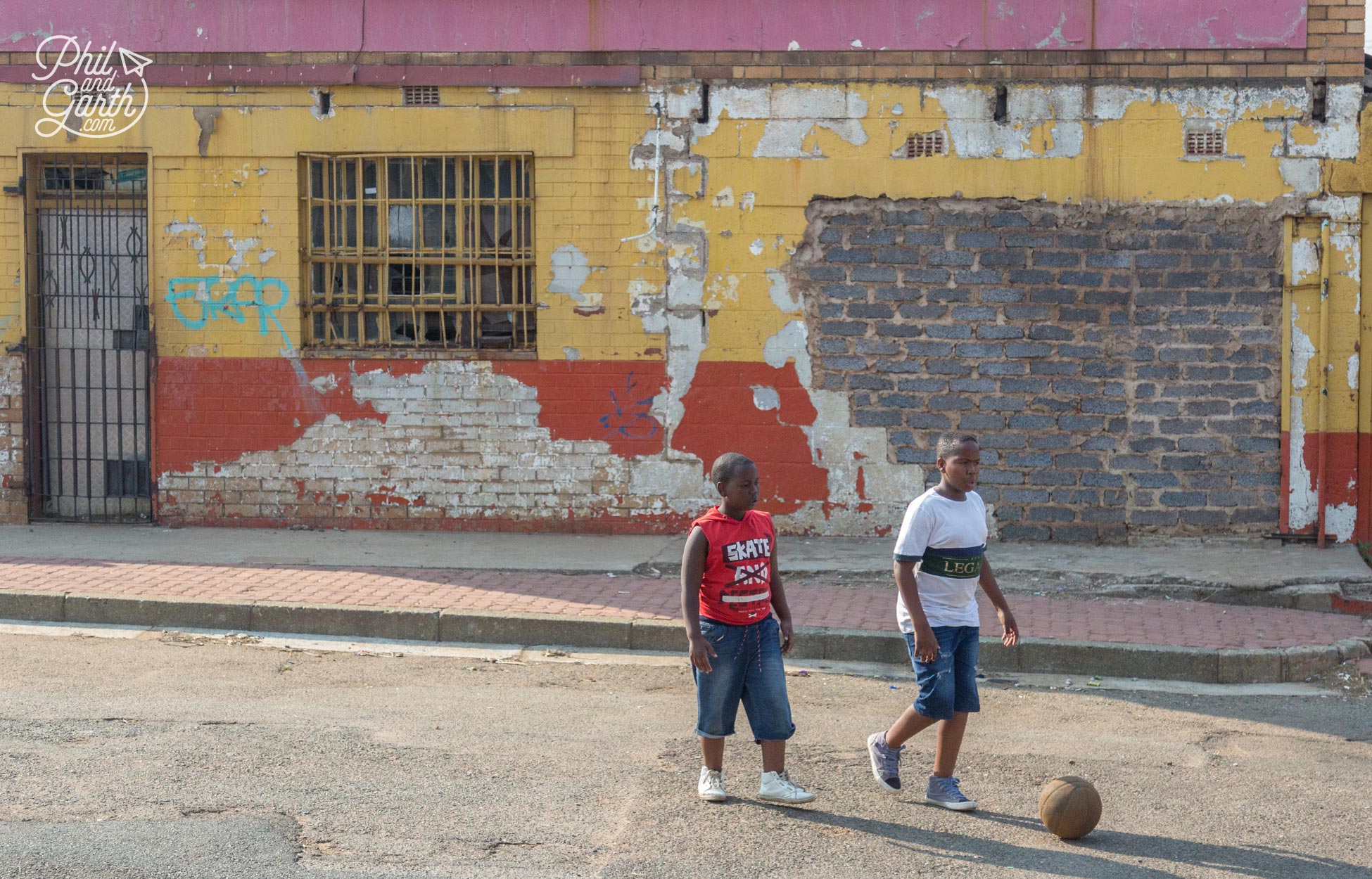 Children playing football in the streets of Soweto