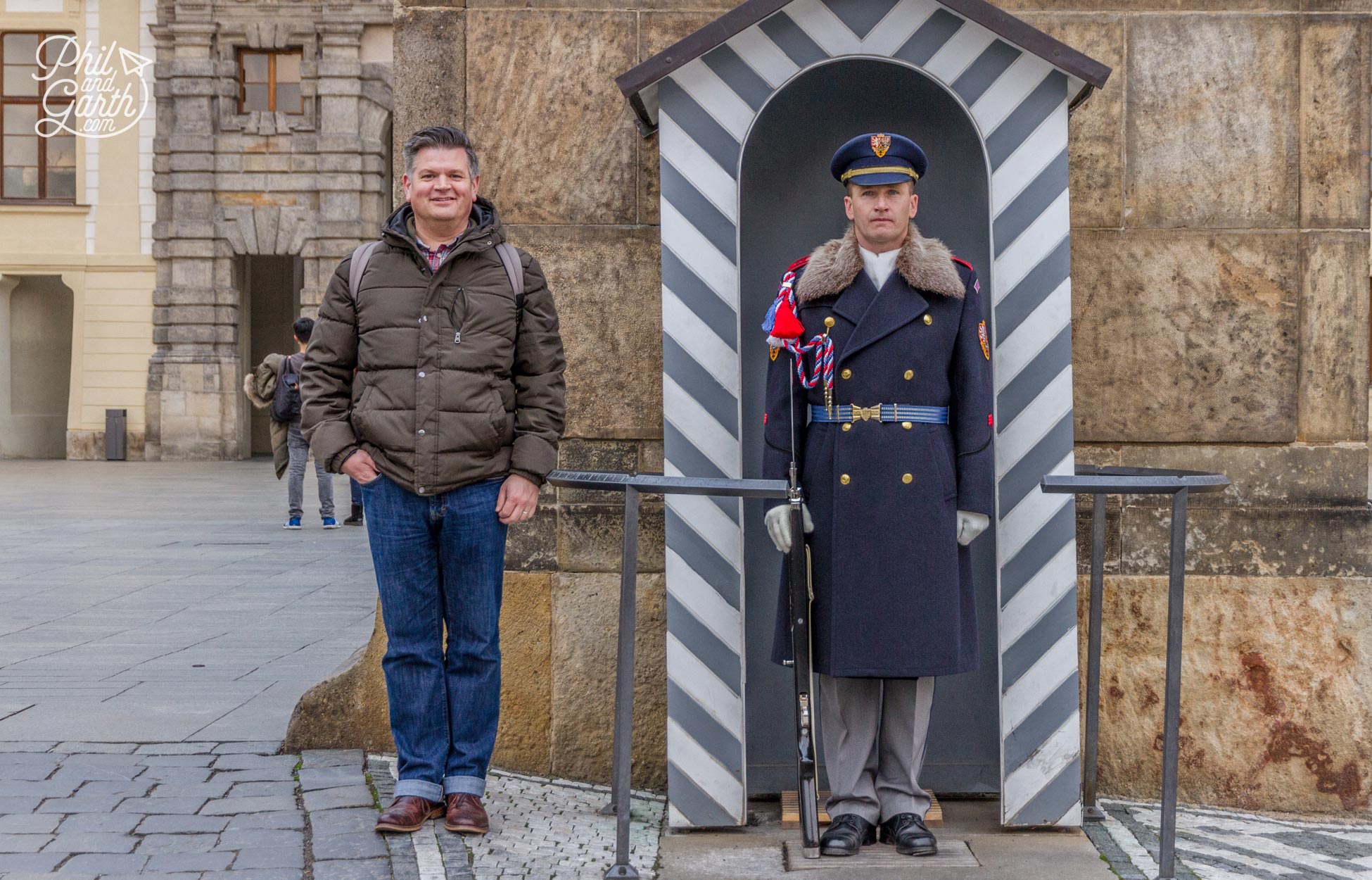 Phil stood with a guard at Prague Castle