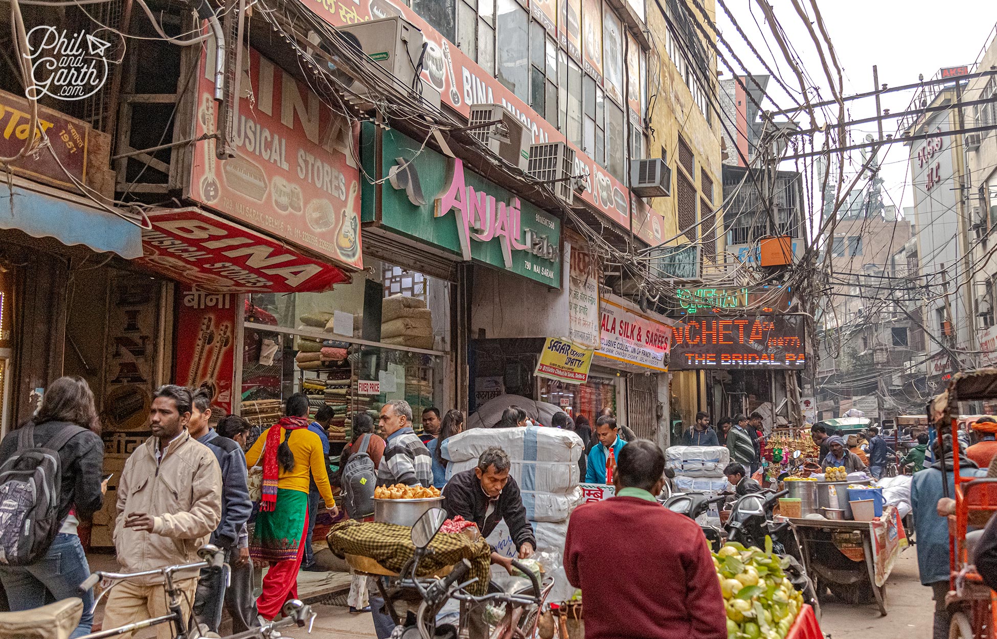 Rickshaws, bikes, people even cows narrowly avoid collision