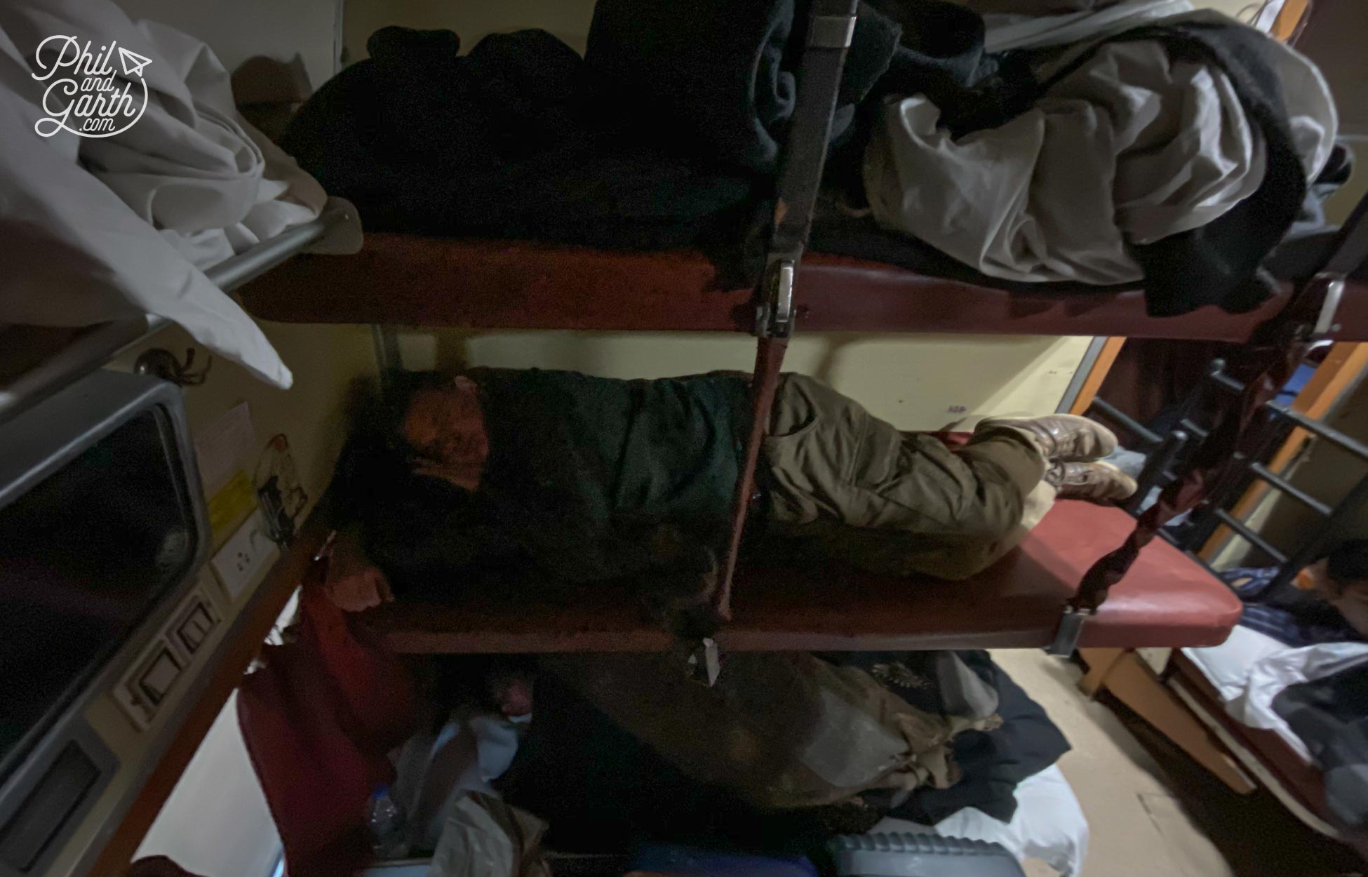 Phil asleep on an AC3 sleeper train from Jaipur to Agra Cantt