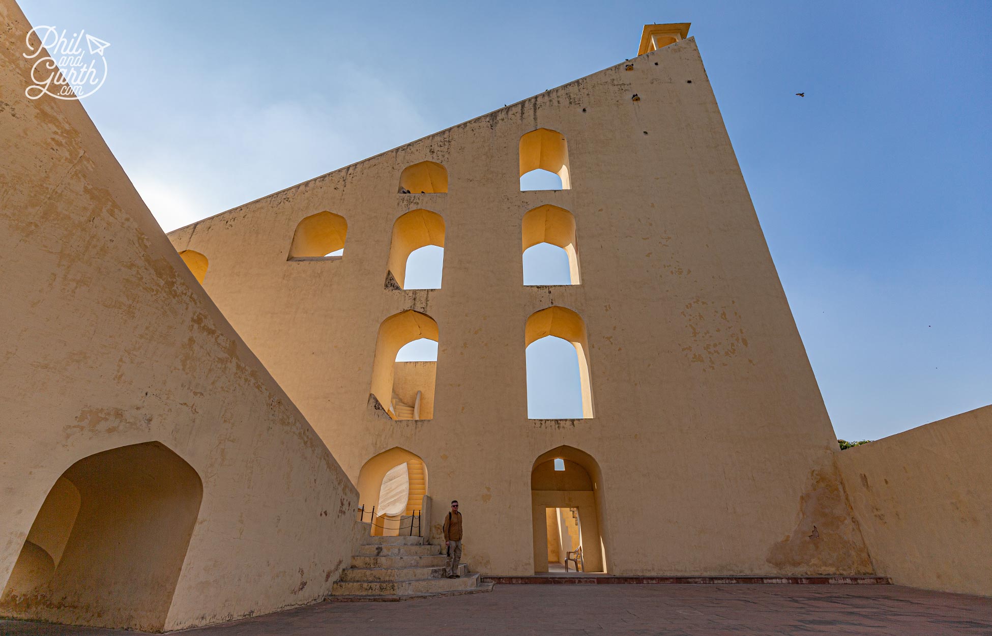 Phil standing on the steps of one of the Jantar Mantar astrological instruments