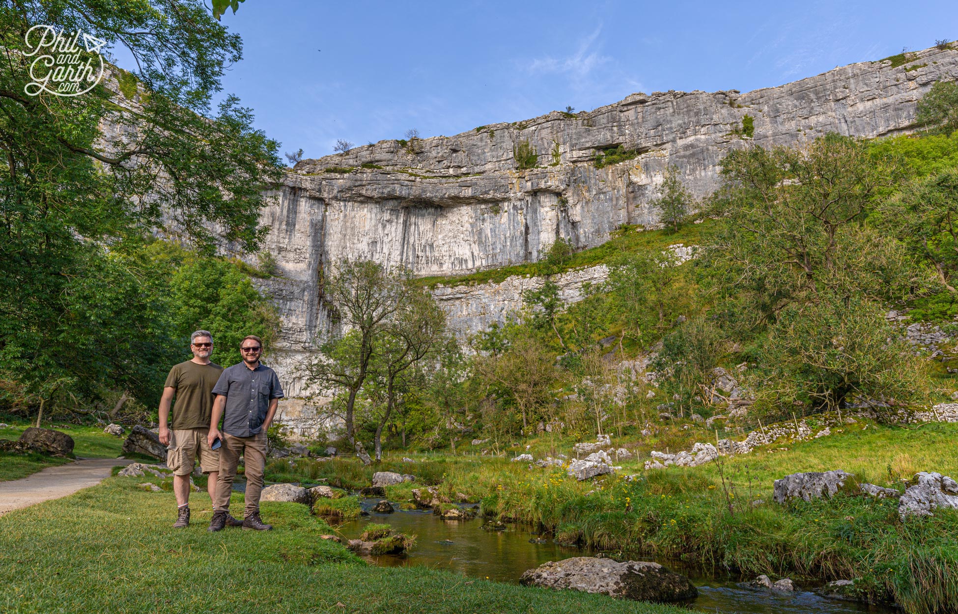 Phil and Garth next to the 80 metre high limestone cliffs of Malham Cove