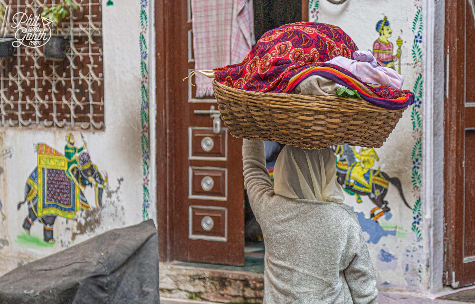 A lady transports her laundry