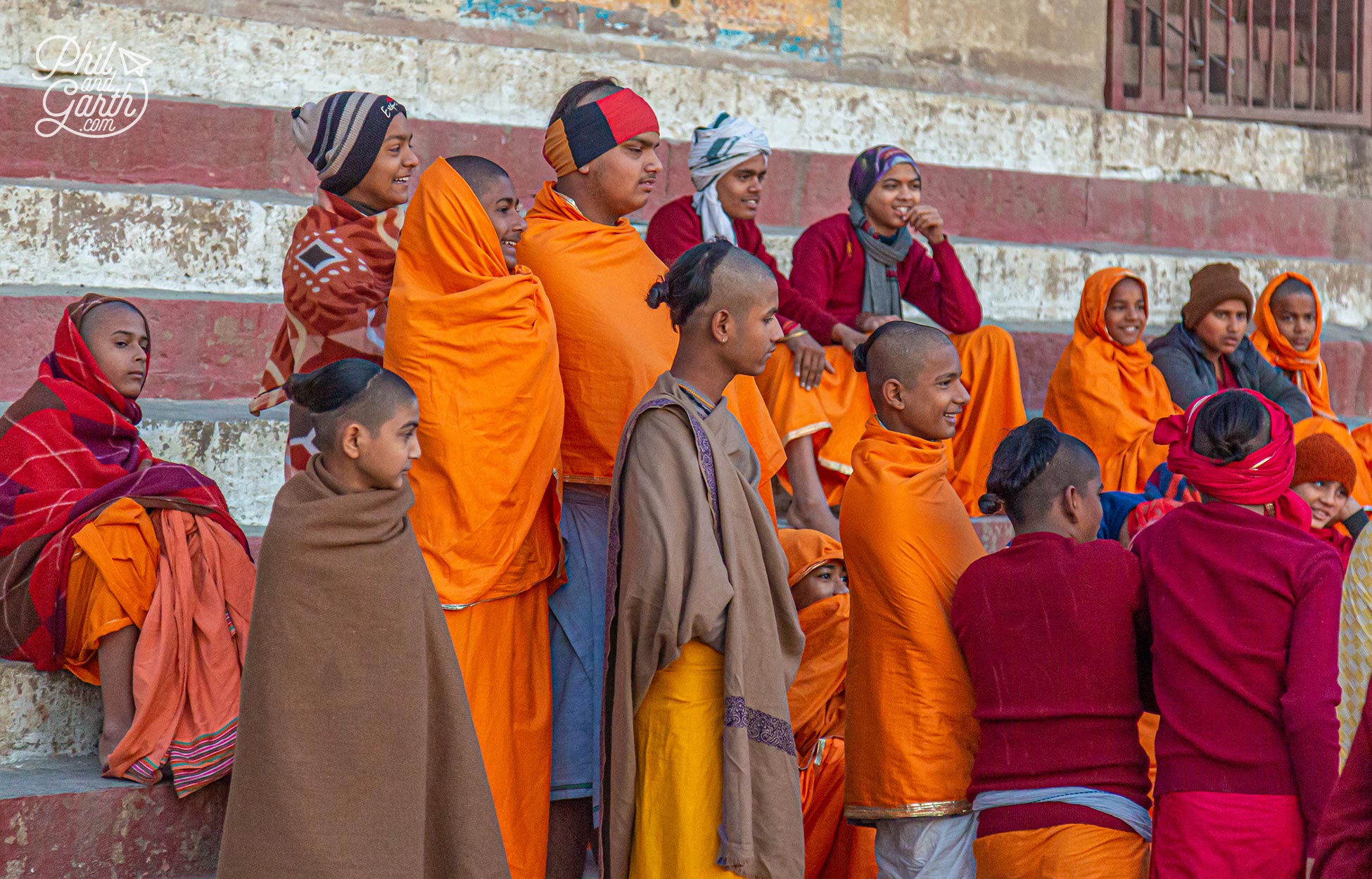 A group of young monks prepare to bathe