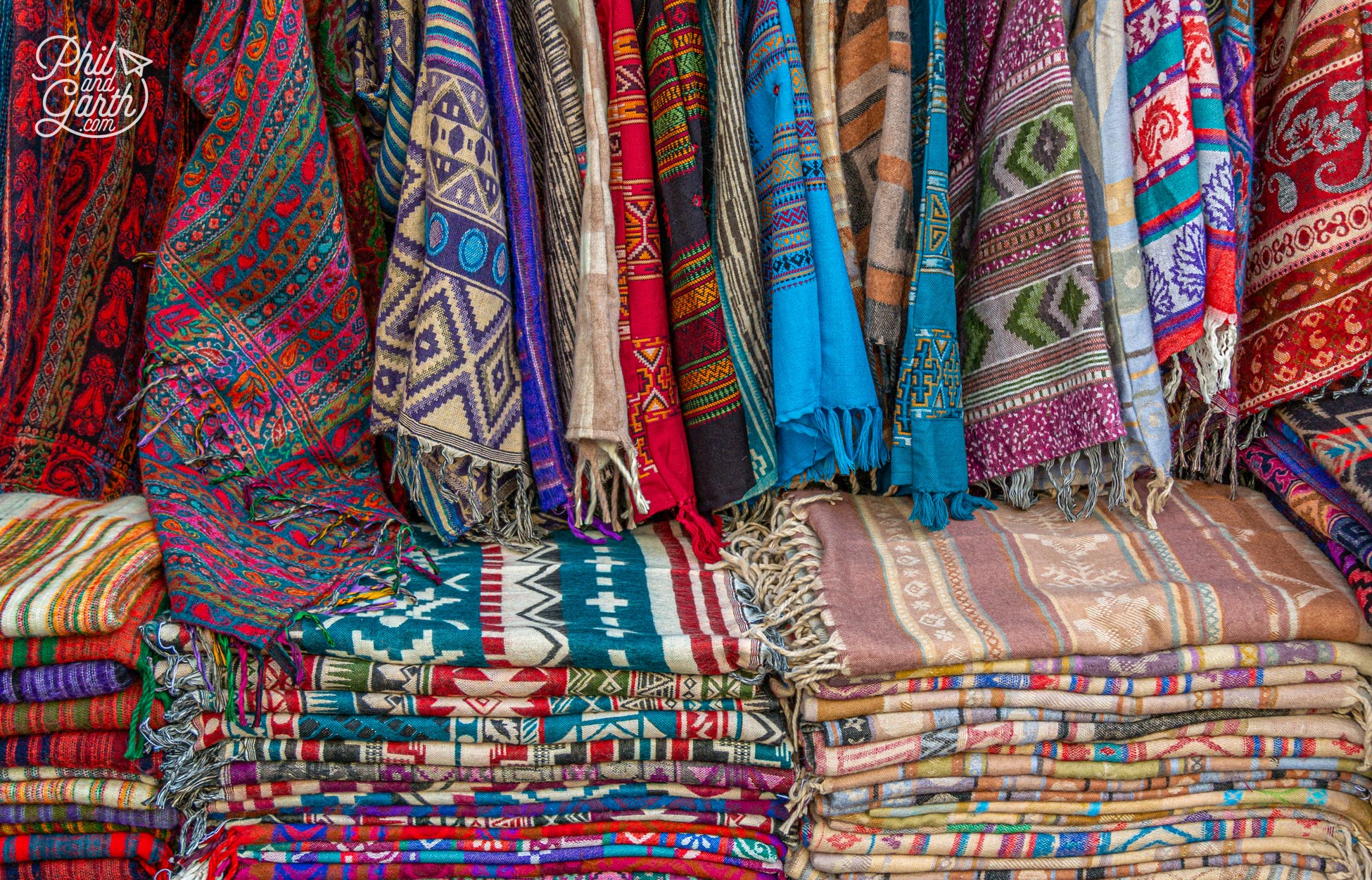 Colourful pashminas for sale in a Pushkar bazaar