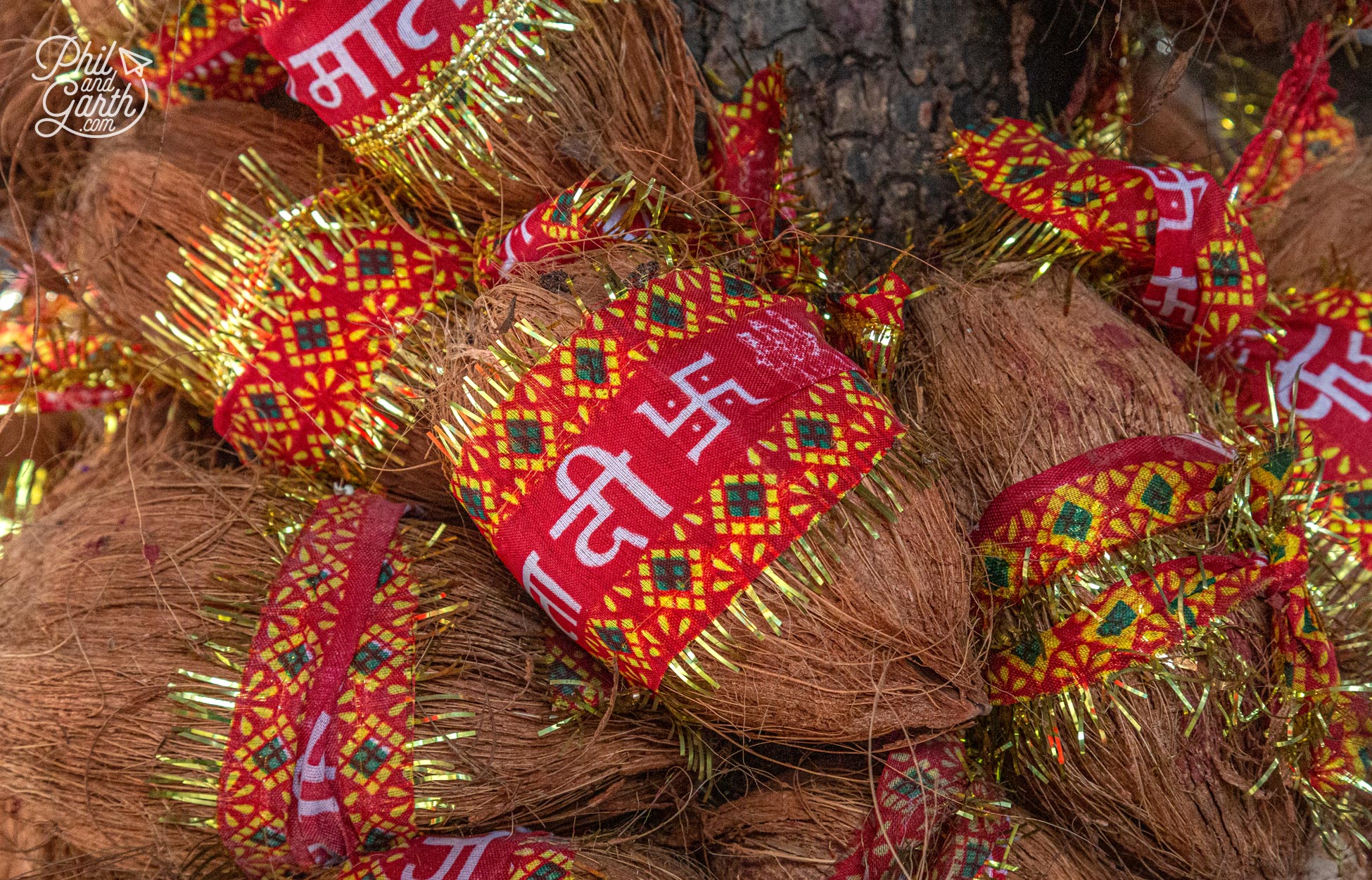 In Hinduism coconuts symbolise God. Whilst the swastika has been a sacred symbol for millions of years