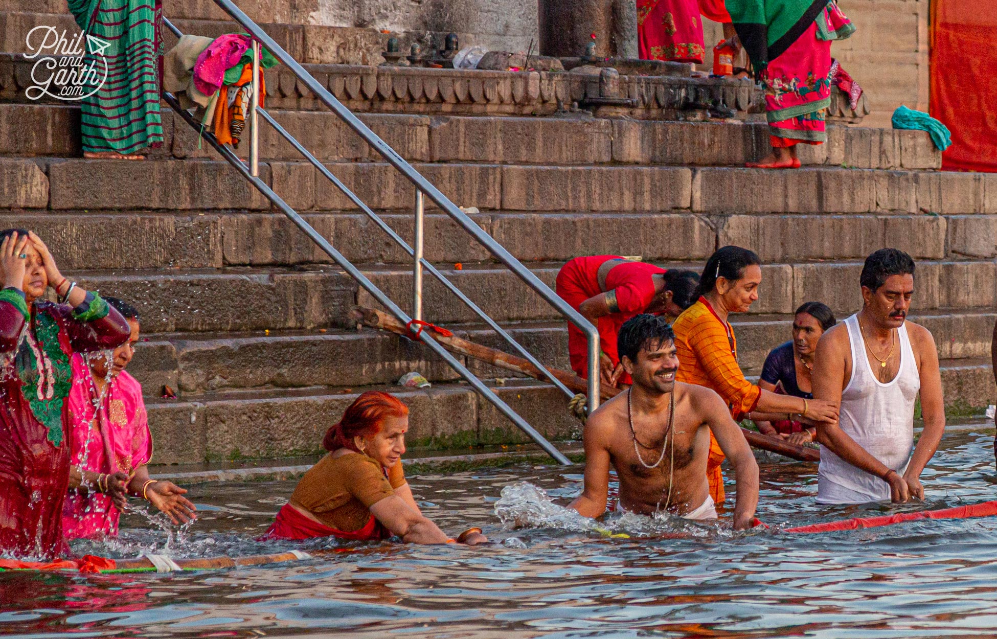 People bathing early morning in the River Ganges. The holy river is personfied as the Goddess Ganga