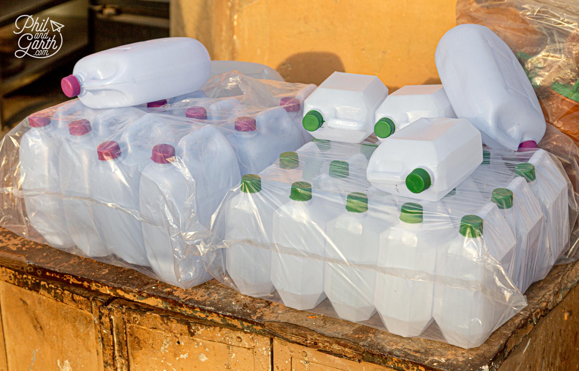 Plastic bottles for sale - so people can take home some holy water from the River Ganges.