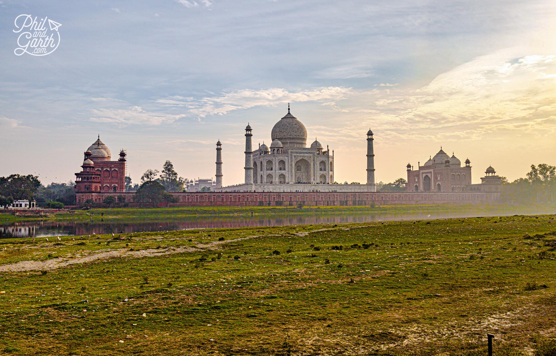 Opposite each side are 2 red sandstone buildings - a mosque and a former guest house