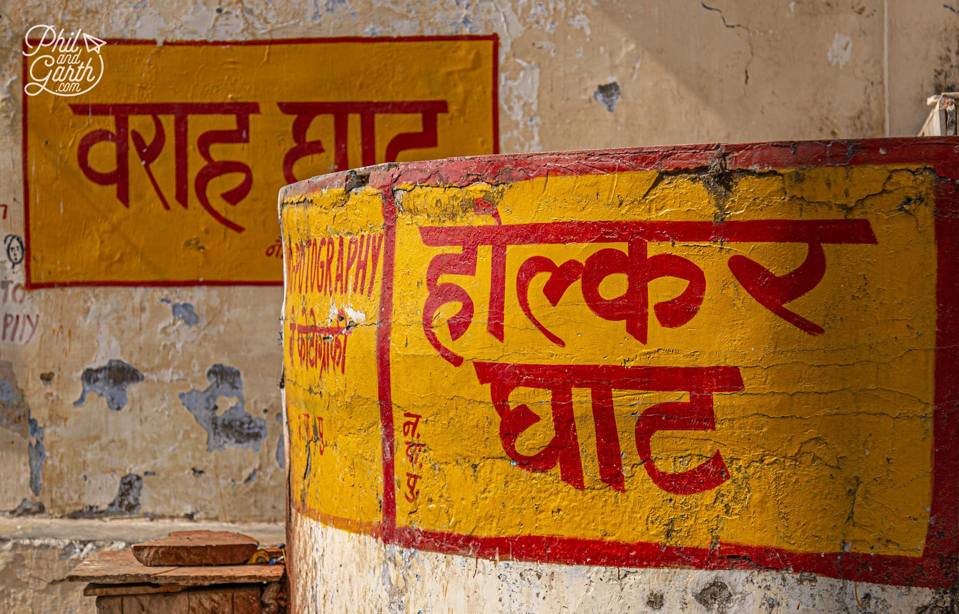 The ghat signs are hand painted in distinctive yellow and red colours