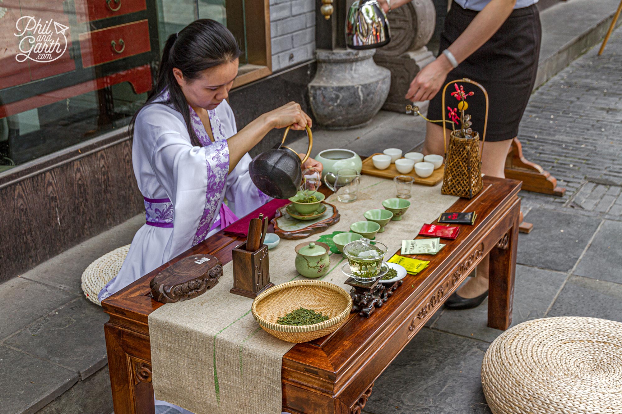 One word - tea! everyone drinks it. A lady serves tea on the street