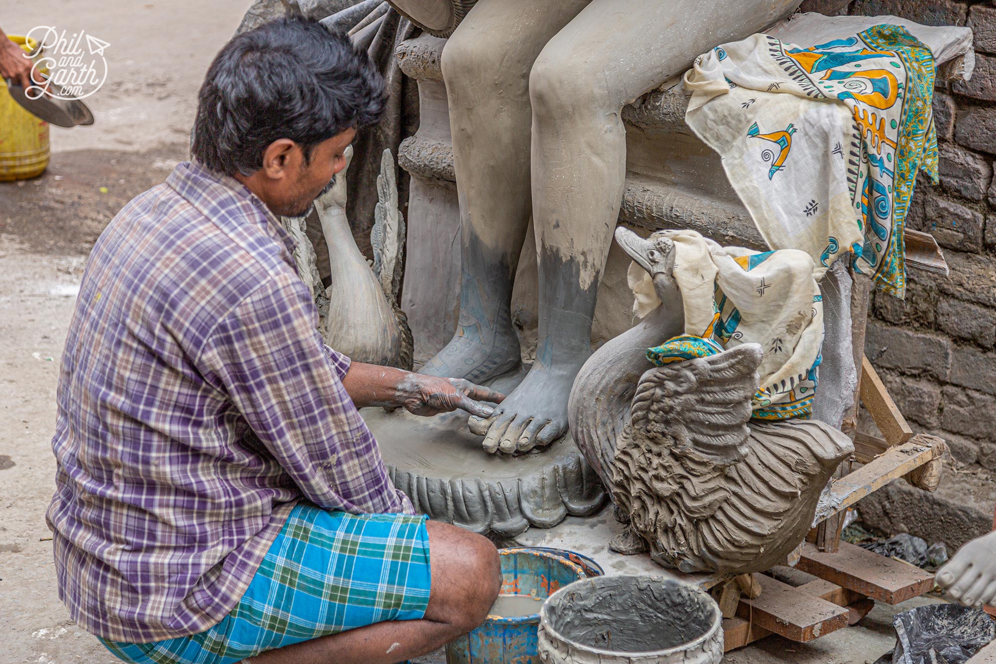 Clay modellers use mud from the sacred Ganges river