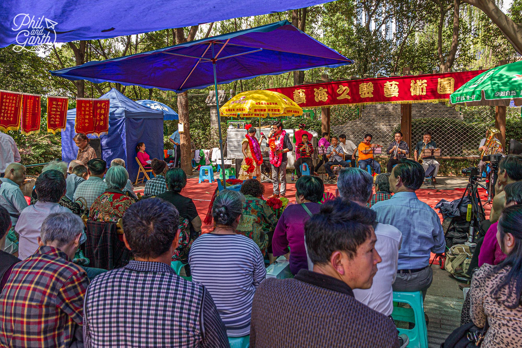 Mingling with the locals at People's Park. Looks like some kind of singing competition