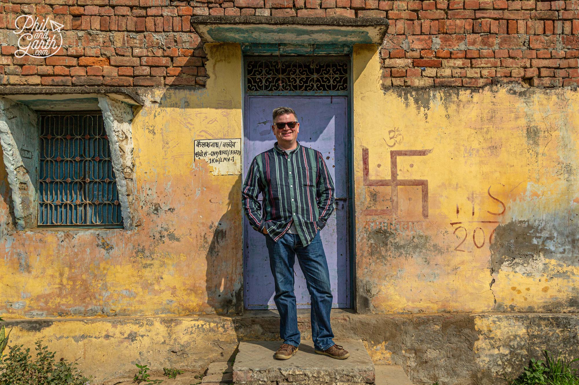 Swastika symbols are placed next to people's front doors to wish good fortune on all who enter their homes