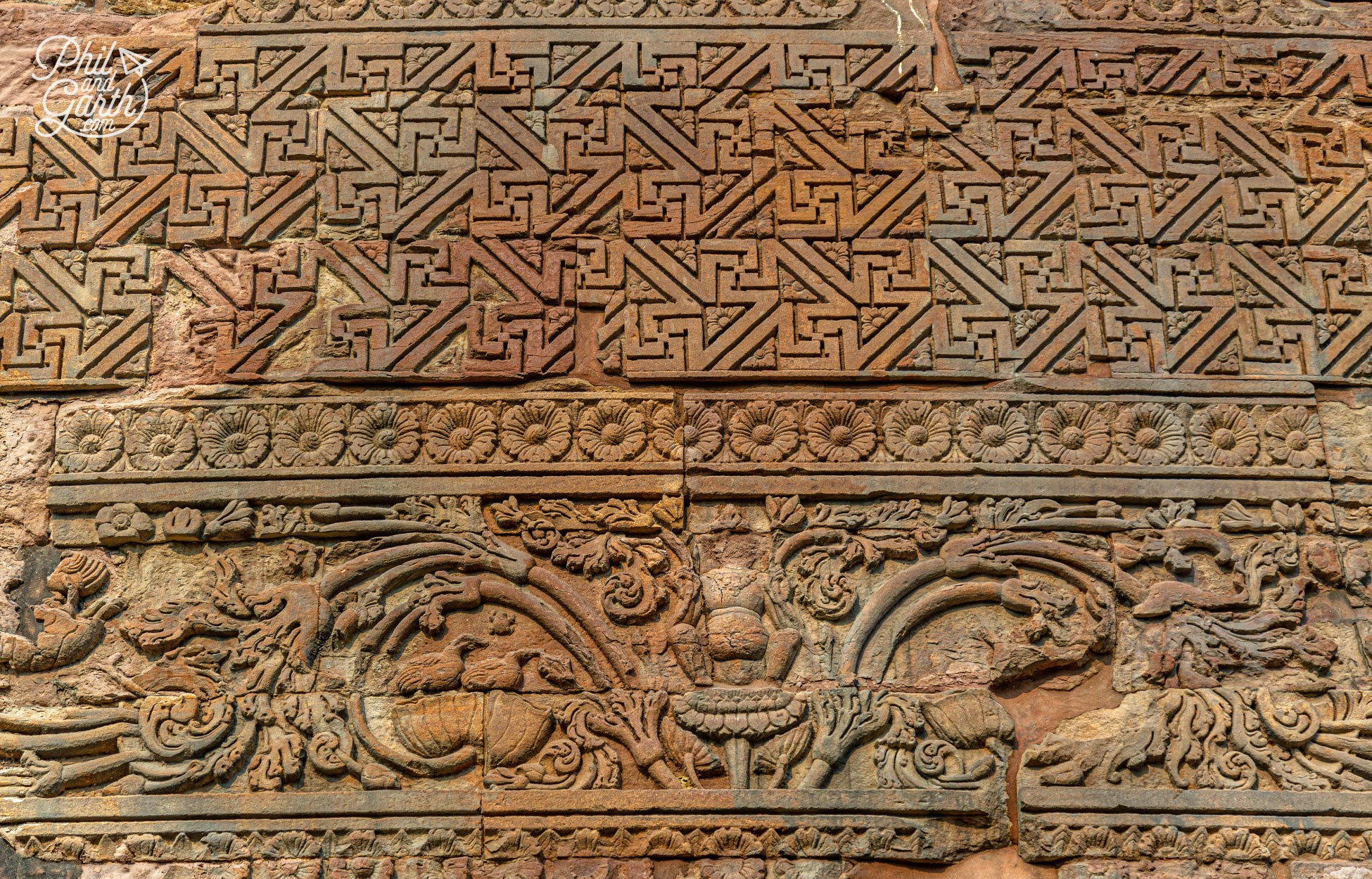 The Dhamek Stupa's carvings include flowers, birds and people