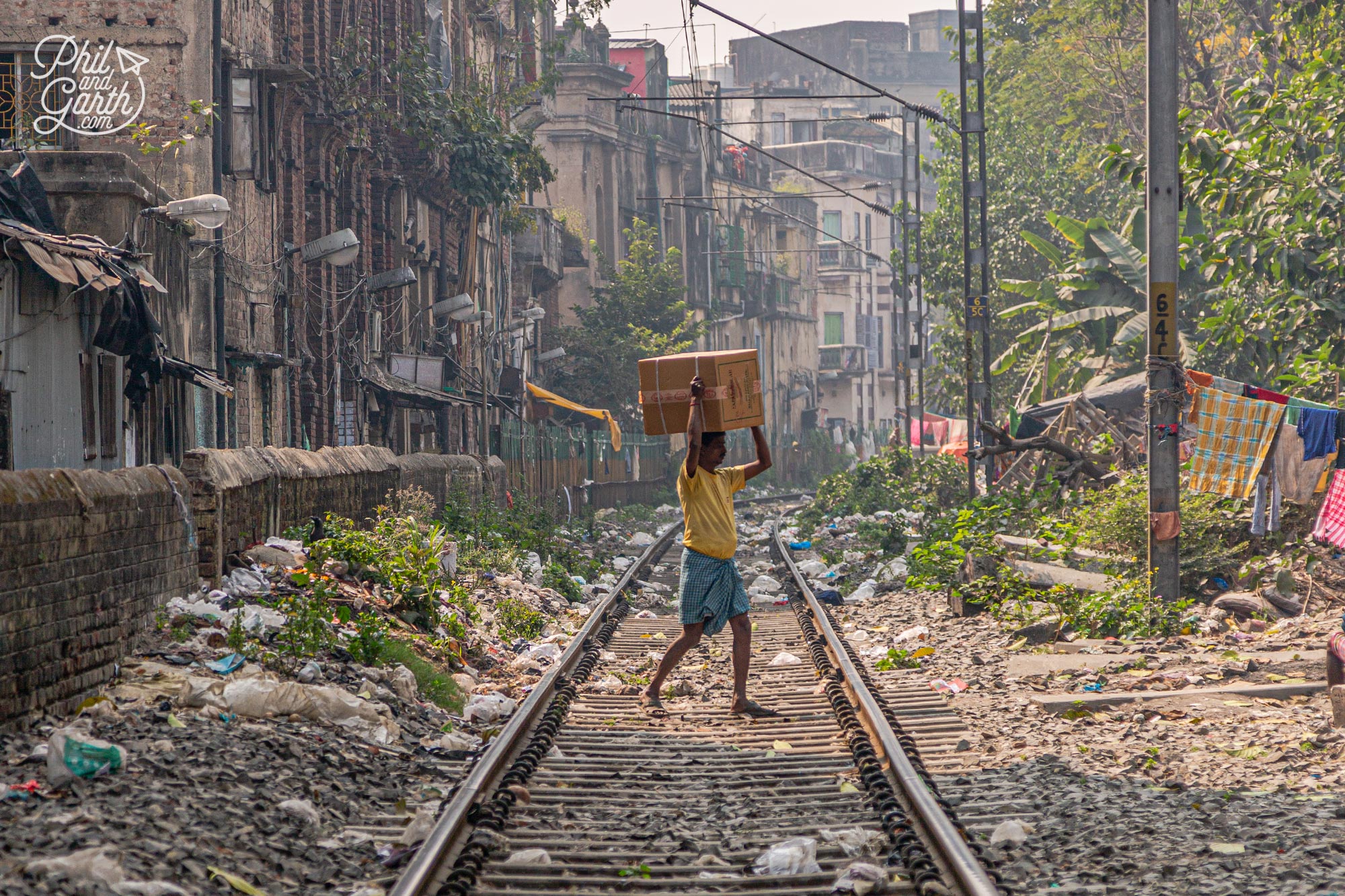 A man crosses a railway track in North Kolkata