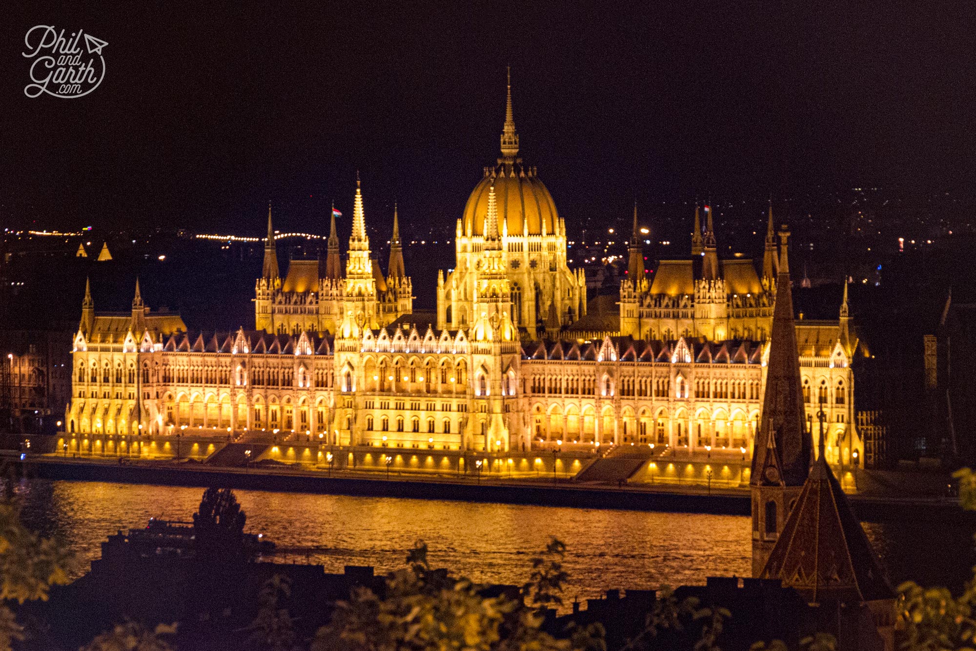 A view of the Hungarian Parliament Building at night from Fisherman’s Bastion