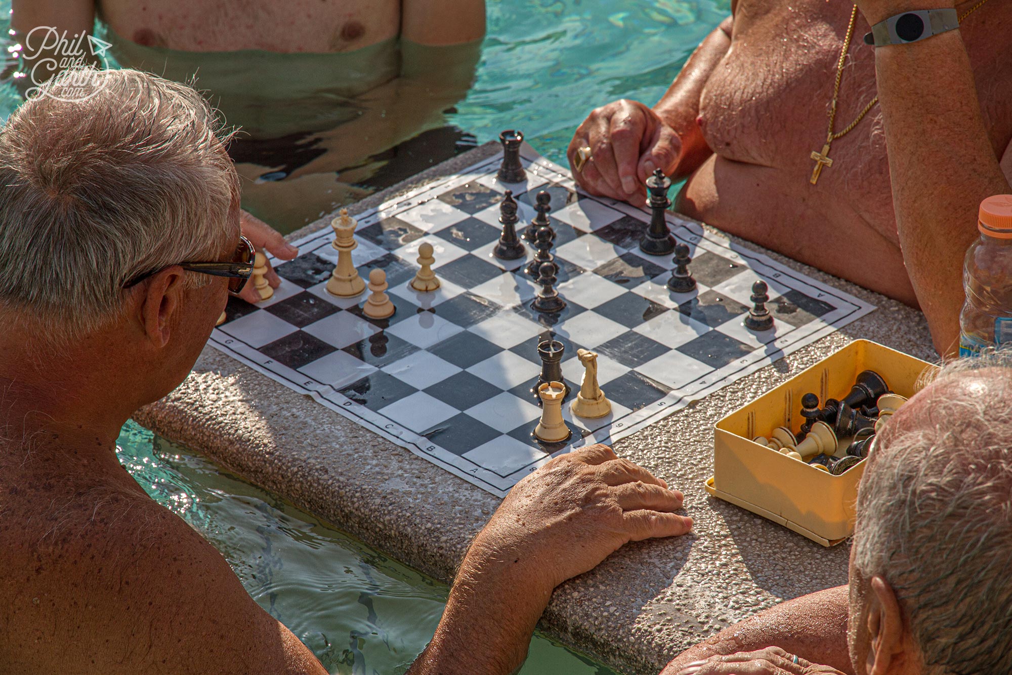 Guys playing chess at the Széchenyi Baths in Budapest Hungary