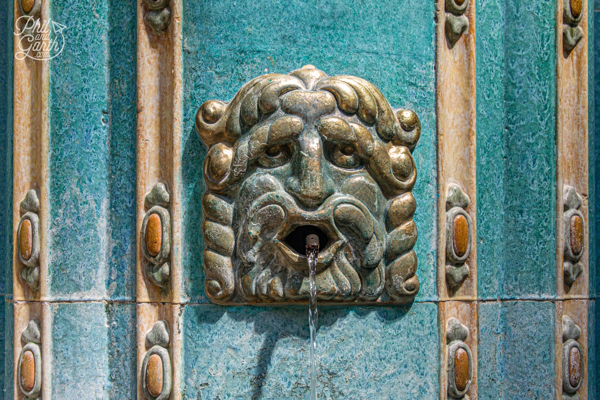 This face serves up hot water in the Gellért Spa