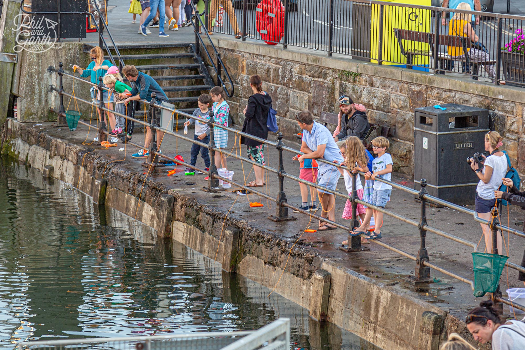 Crabbing in Whitby Harbour - a popular activity for families