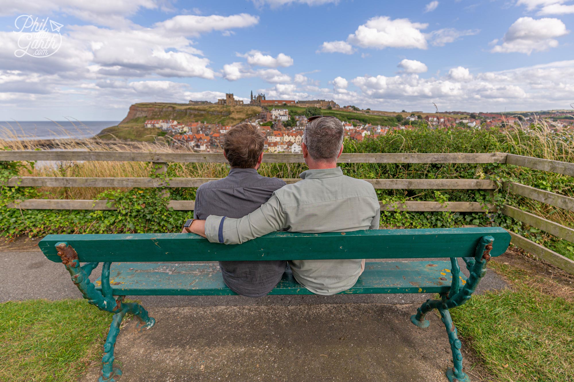 Phil and Garth sat on the Bram Stoker bench looking out to the view of Whitby Abbey that inspired him