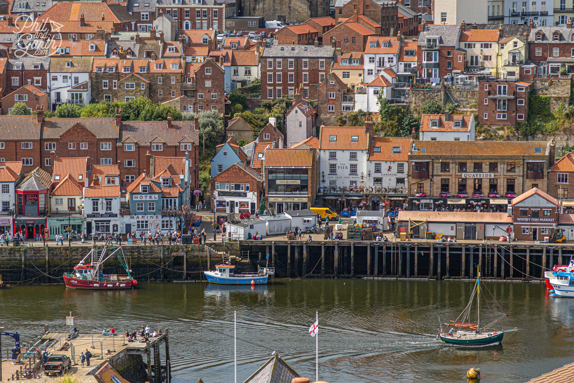 The view from the 199 Steps of Whitby's harbour and red rooftops