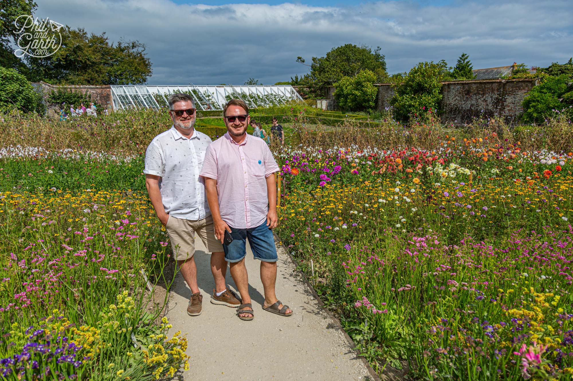 Phil and Garth amongst the colourful blooms of Heligan's Flower Garden