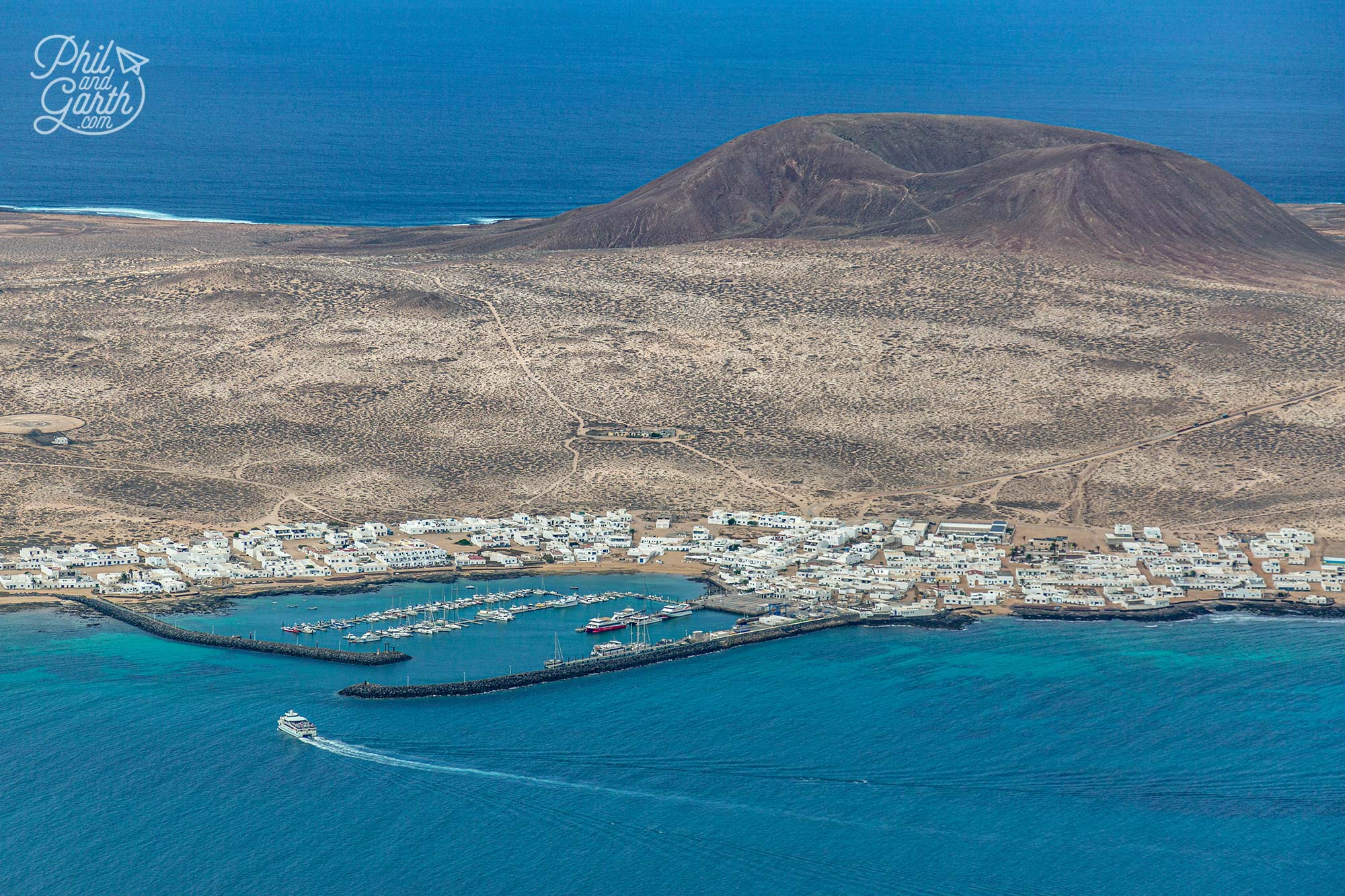 You can get a ferry from Lanzarote to La Graciosa - there are no tarmac roads on the island