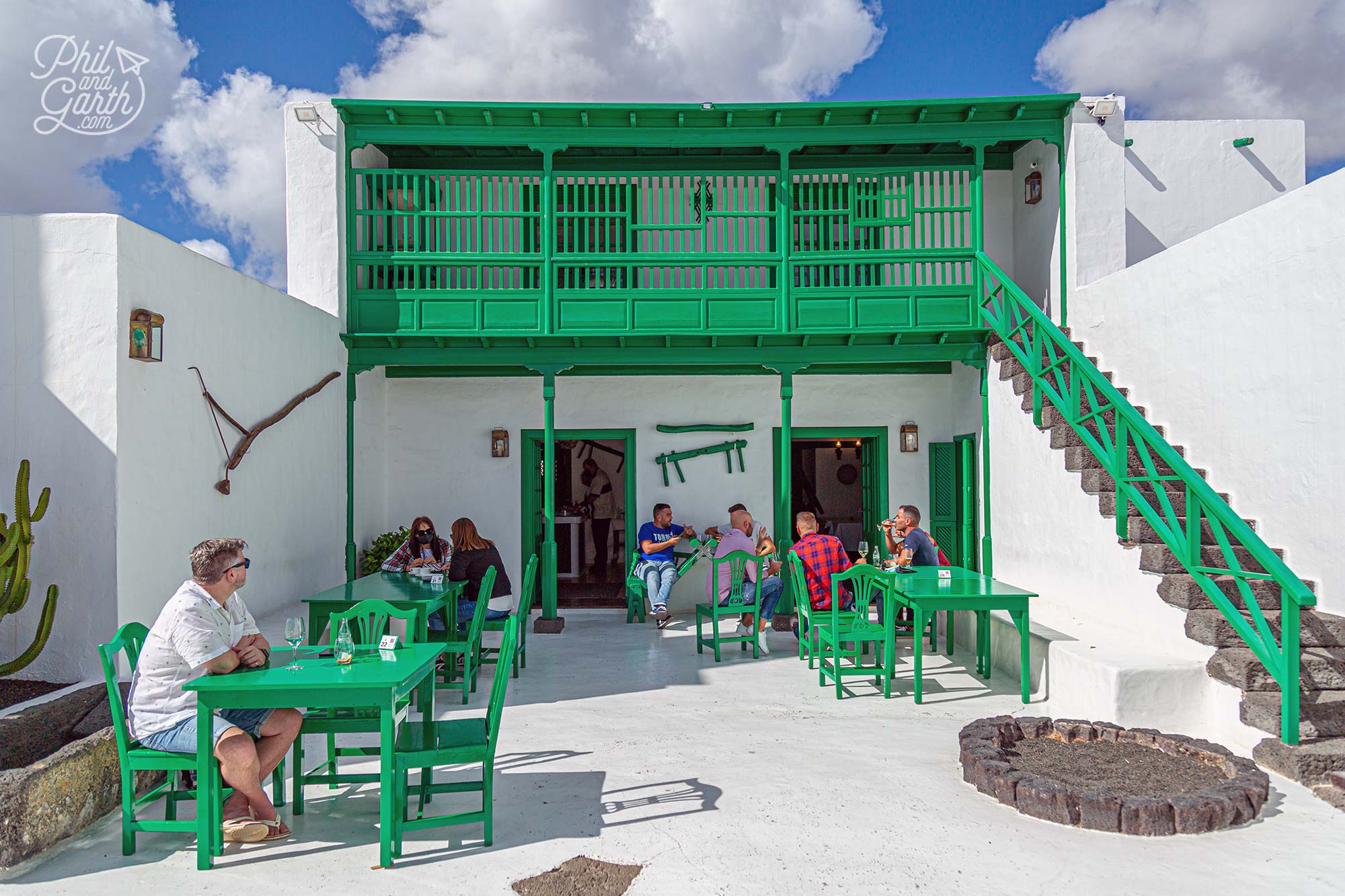The bar painted in buildings painted in a traditional Lanzarote farmer's style of white and green