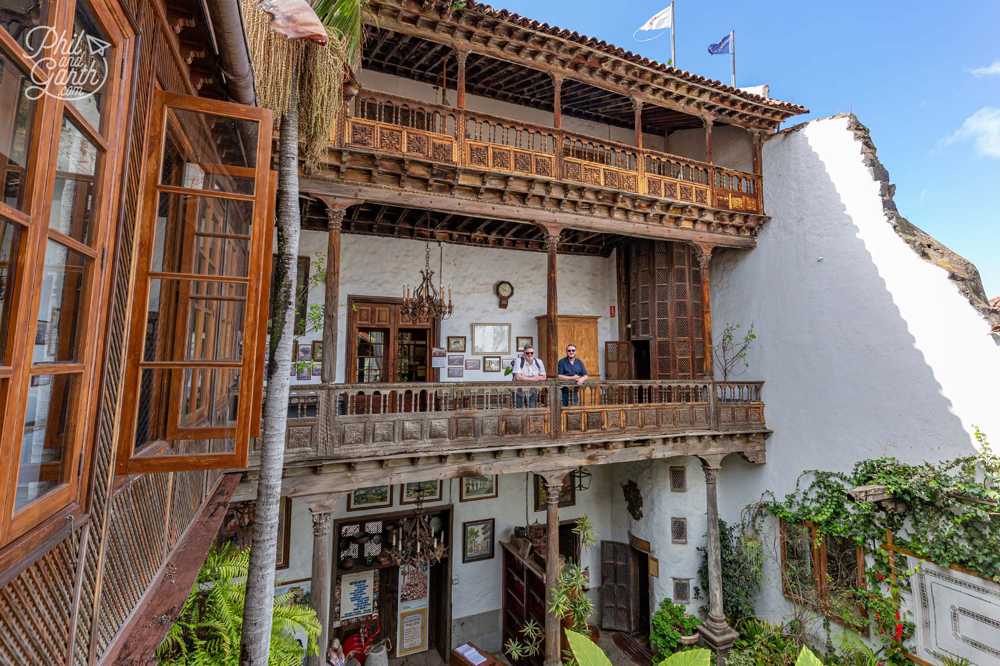 Standing on the old wooden balcony at Casa de los Balcones