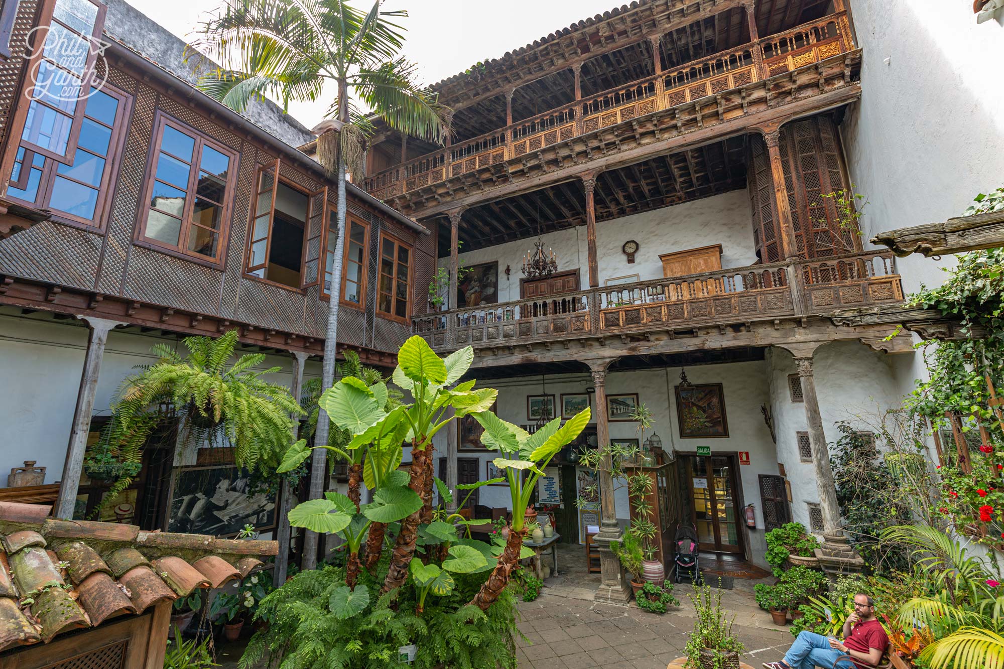 The traditional interior courtyard surrounded by intricate wooden balconies