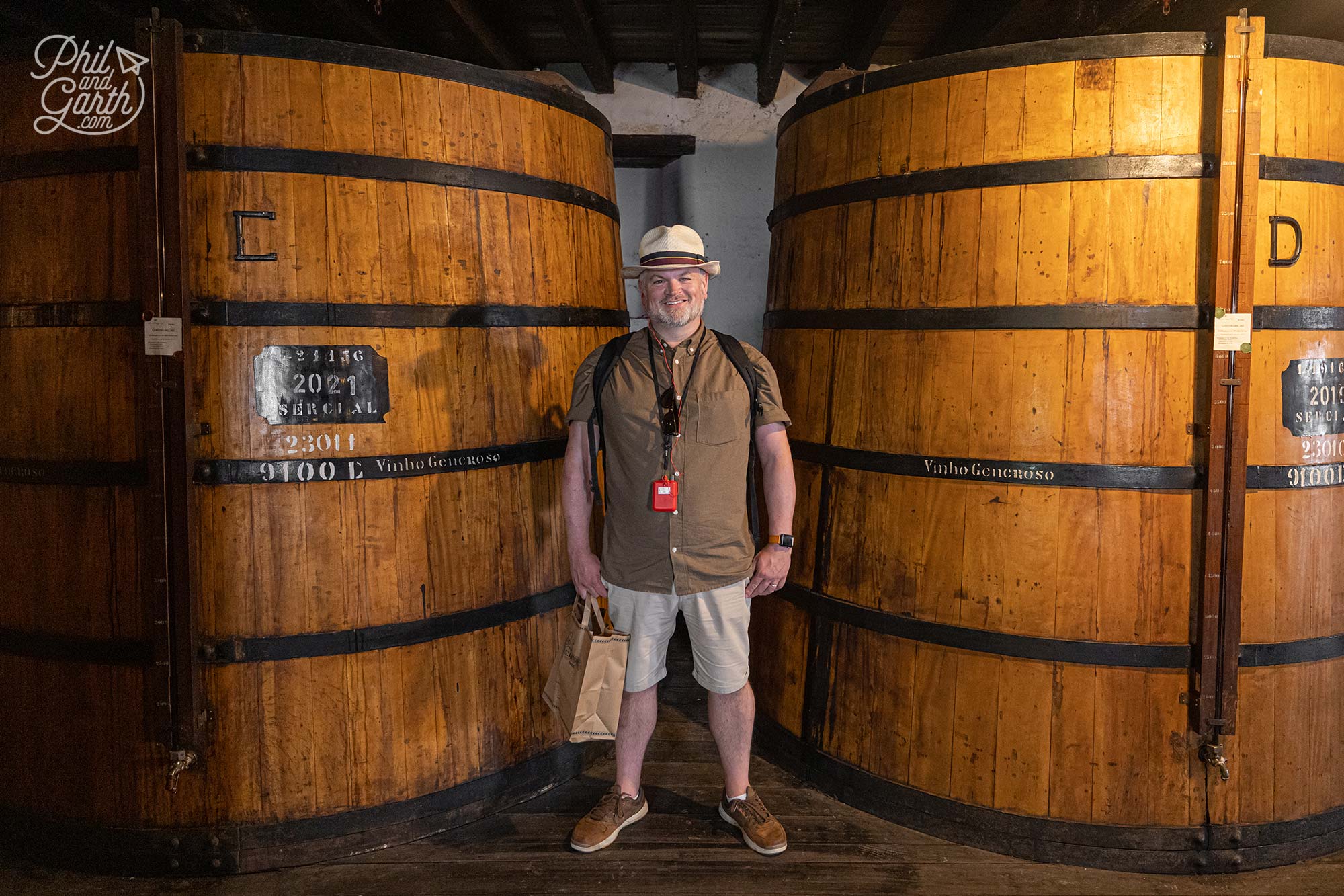Phil stood next to the some of Blandys giant wine barrels