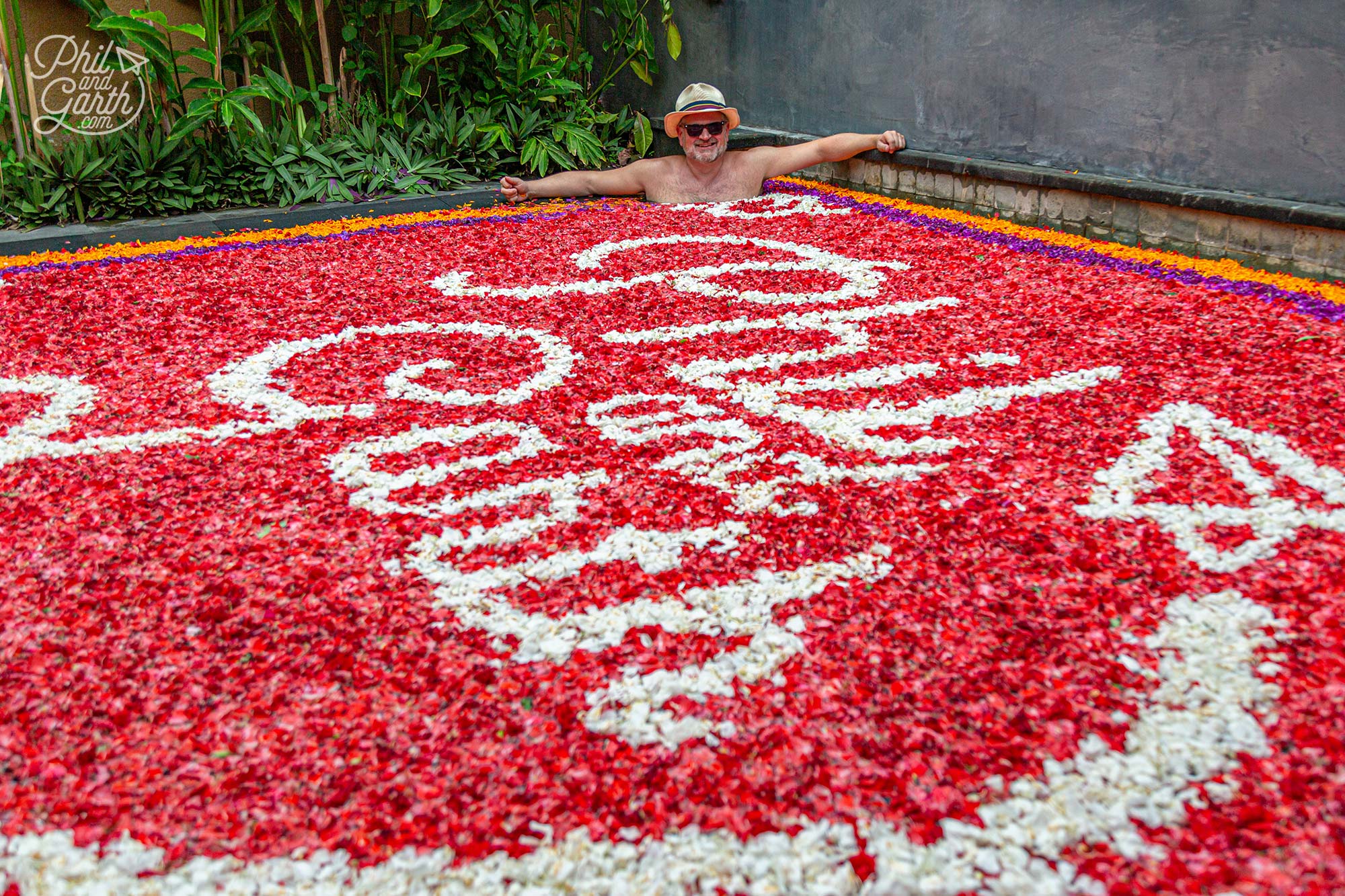 Phil taking in our logo design created with flower petals