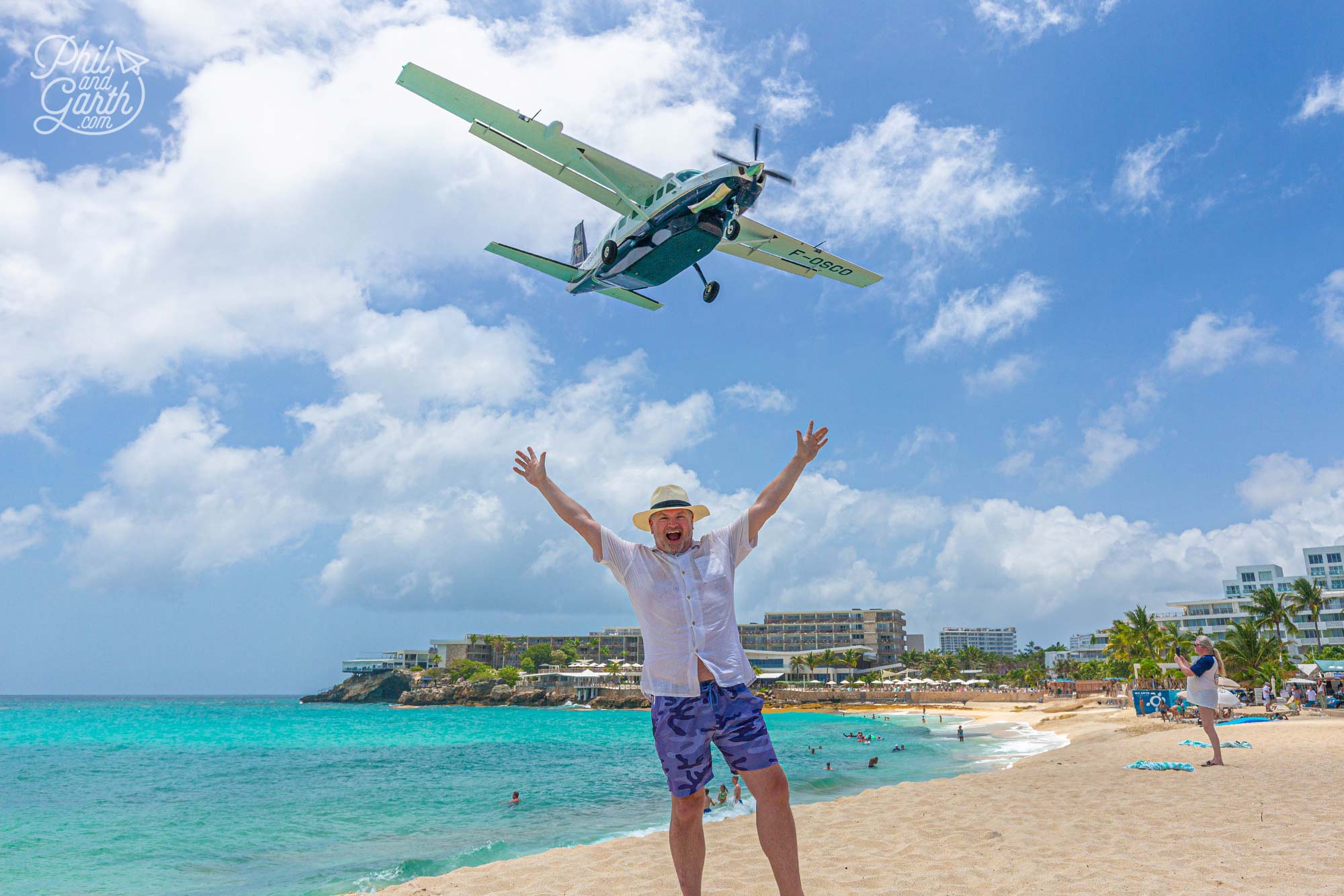 Phil on Maho Beach as a small plane comes into land
