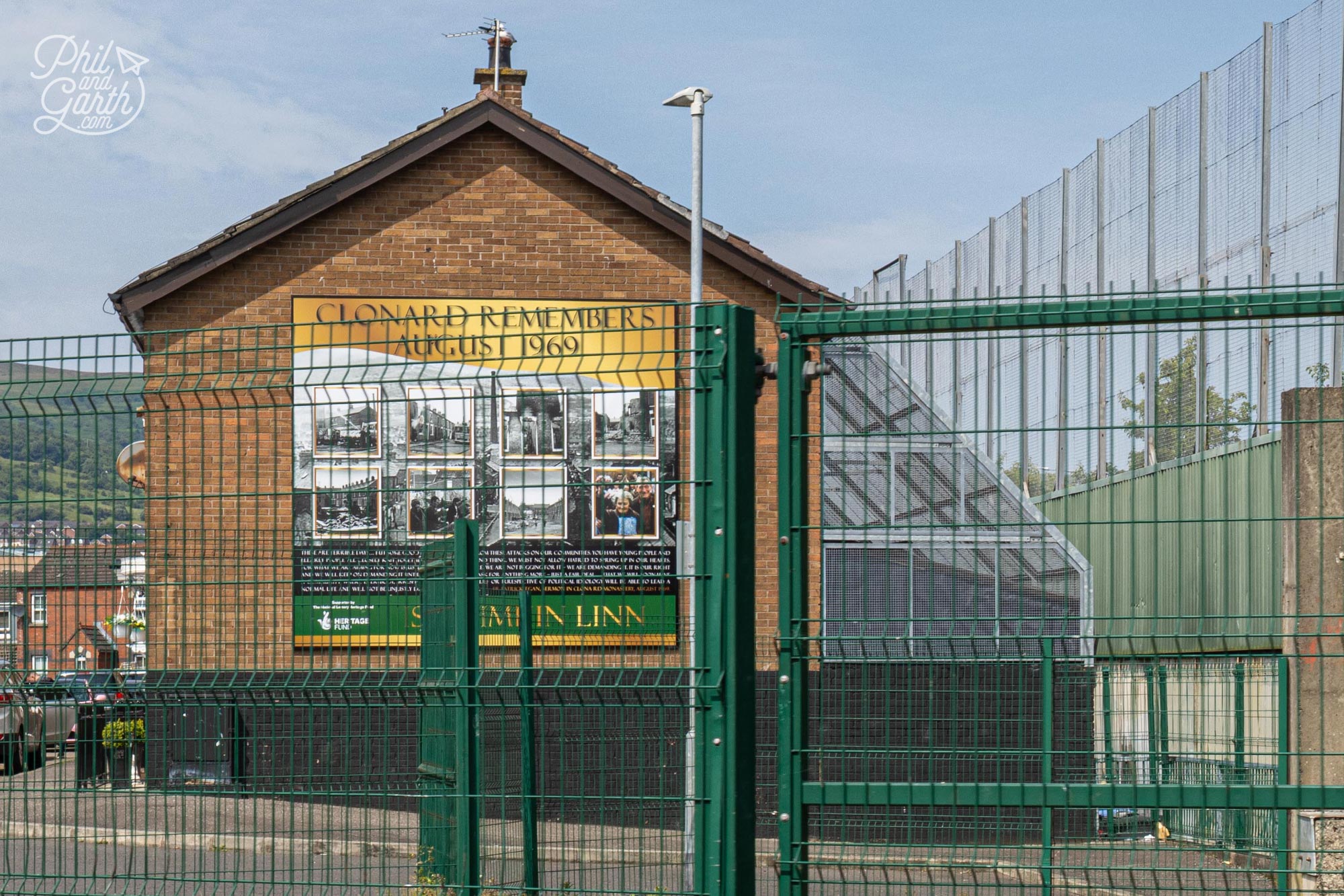 Catholic family homes are protected by cages that back onto the Peace Wall