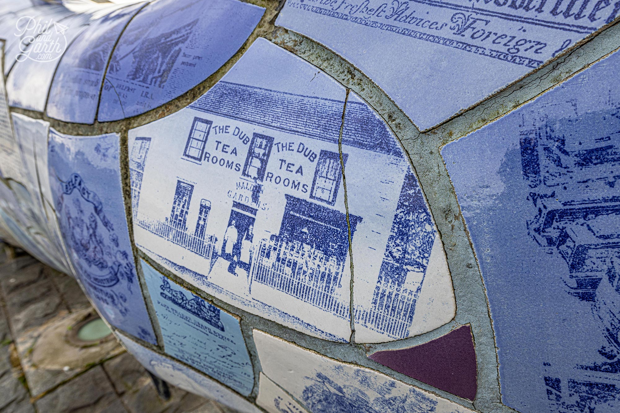 The tiles show images and text of Belfast's history